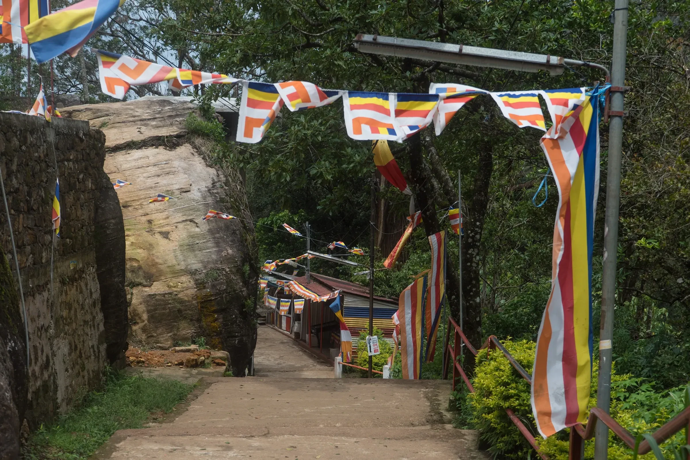 Buddhist prayer flags above the stone steps of the Sri Pada pilgrim path