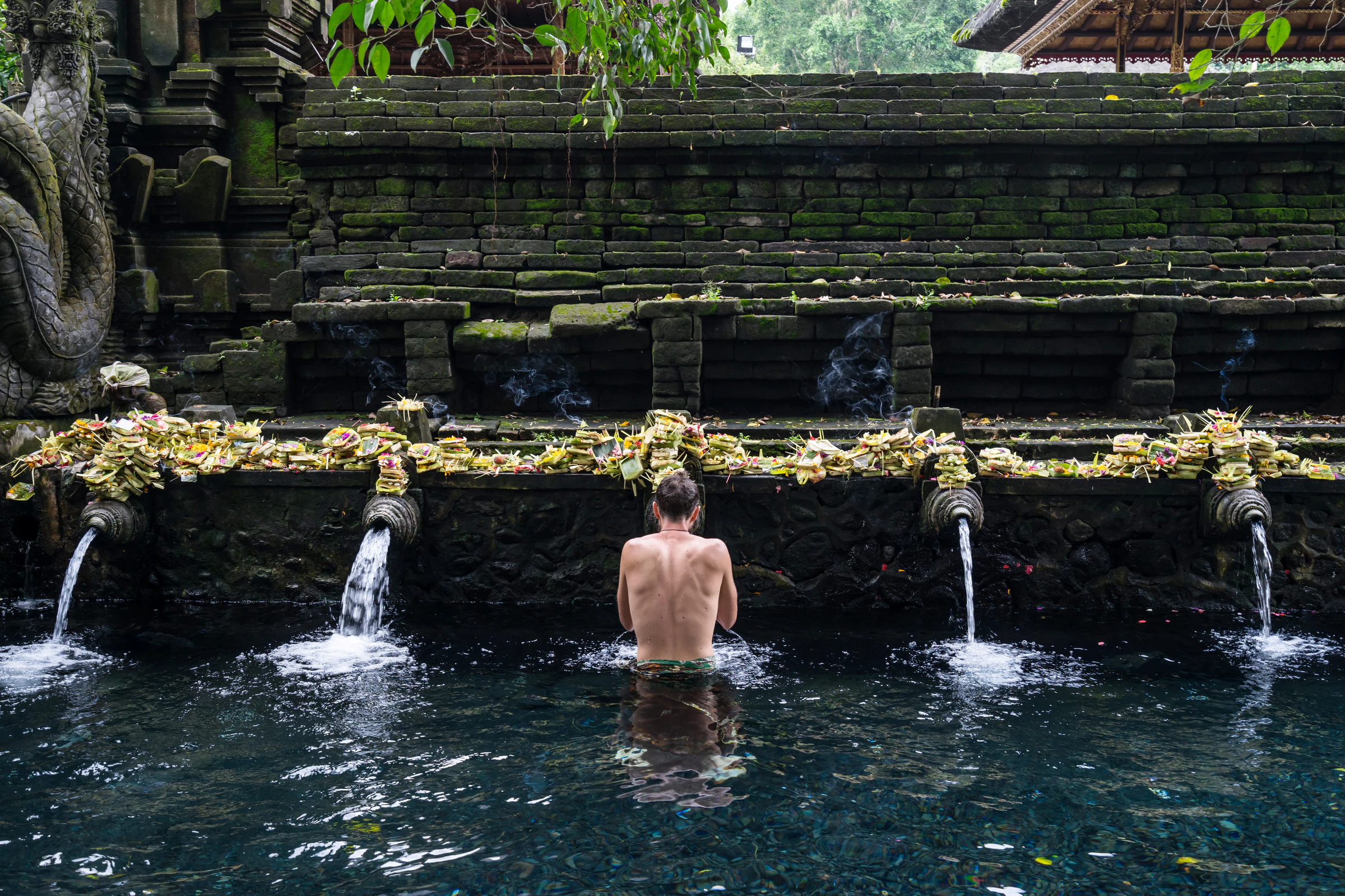 A bather at Tirta Empul, a Hindu temple in Bali known for its holy spring water