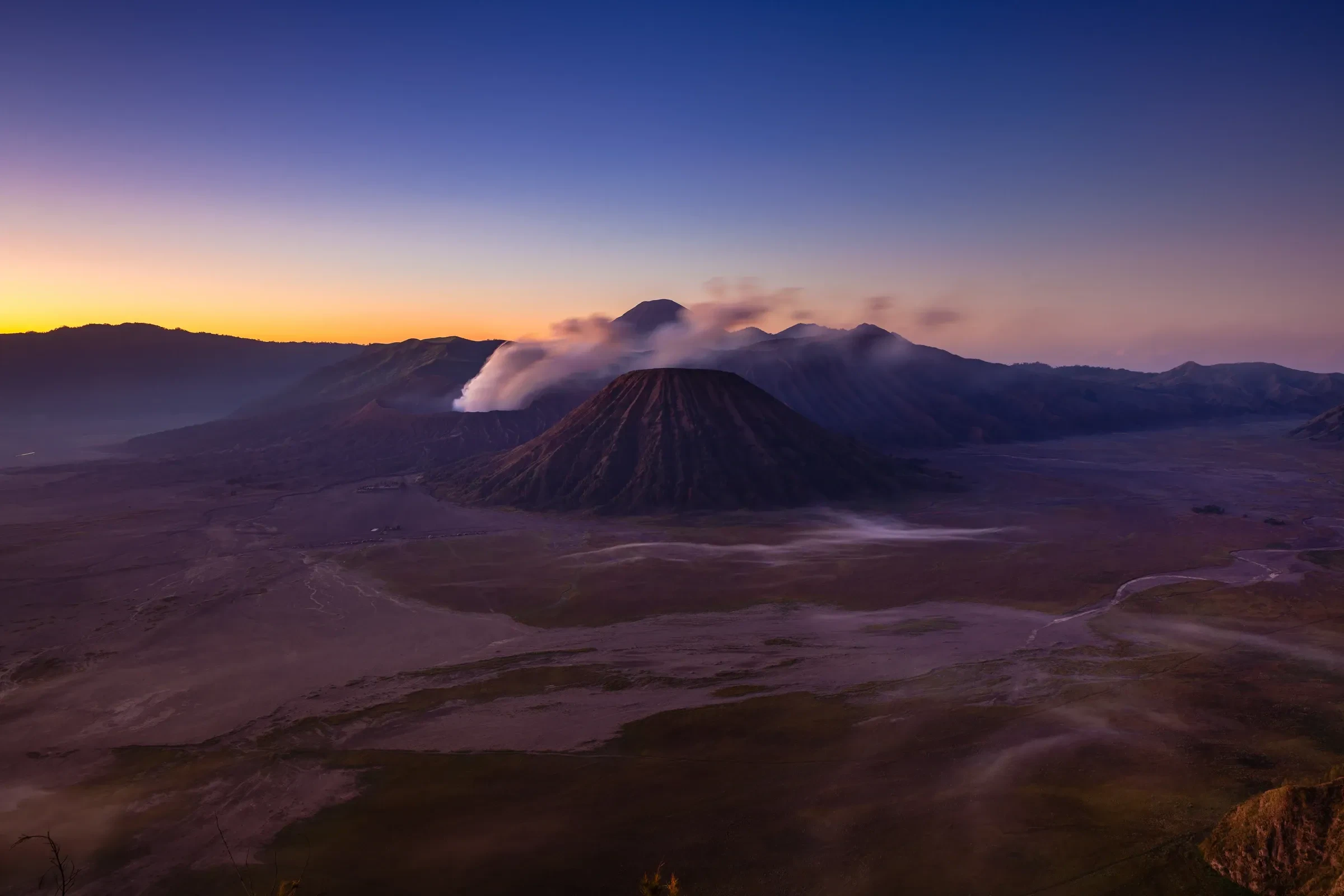 Sunrise over Mount Bromo and the surrounding volcanic landscape in East Java