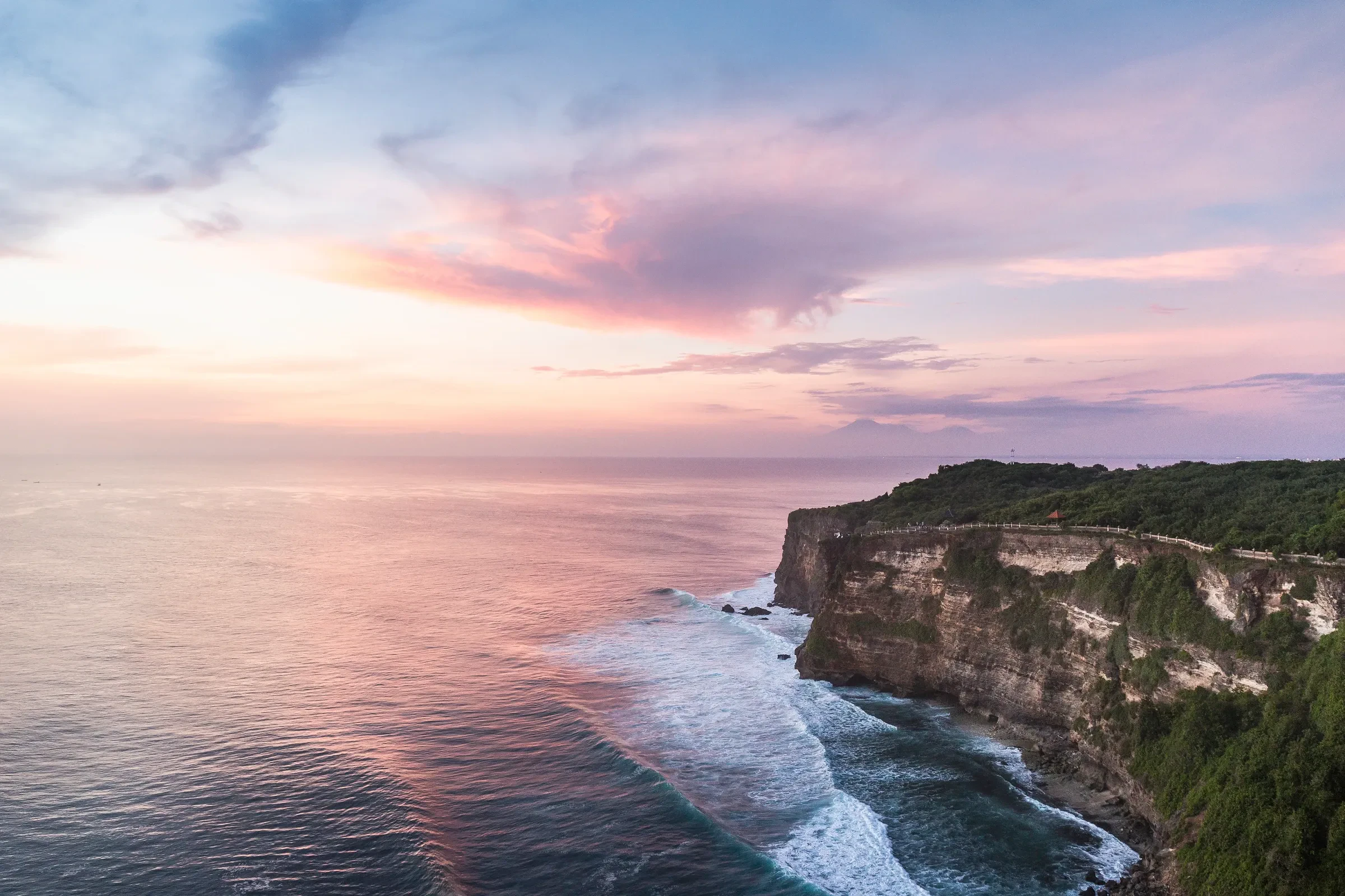 Cliffs and surf at Uluwatu at sunset