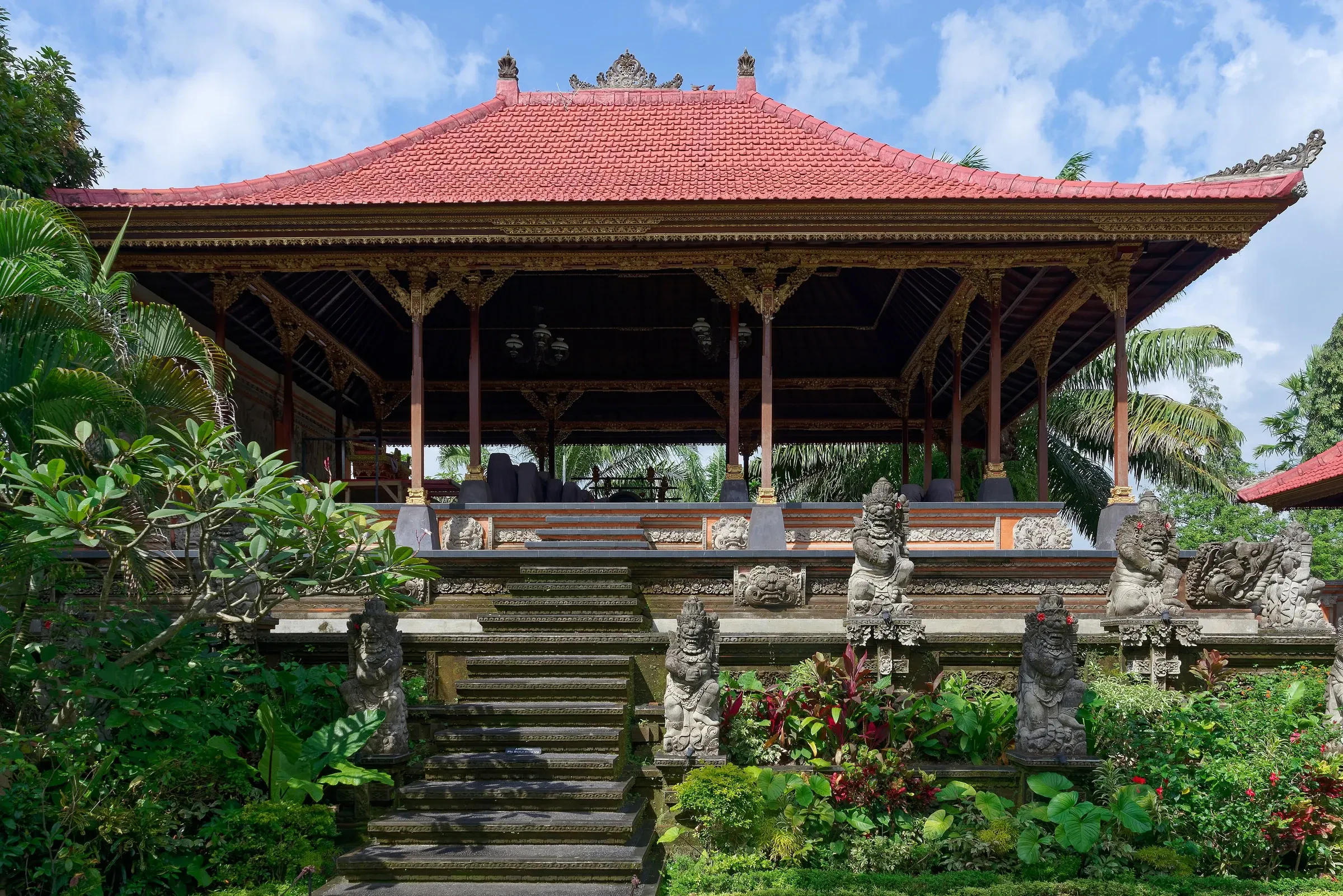 A red-roofed pavilion in the grounds of Ubud Palace