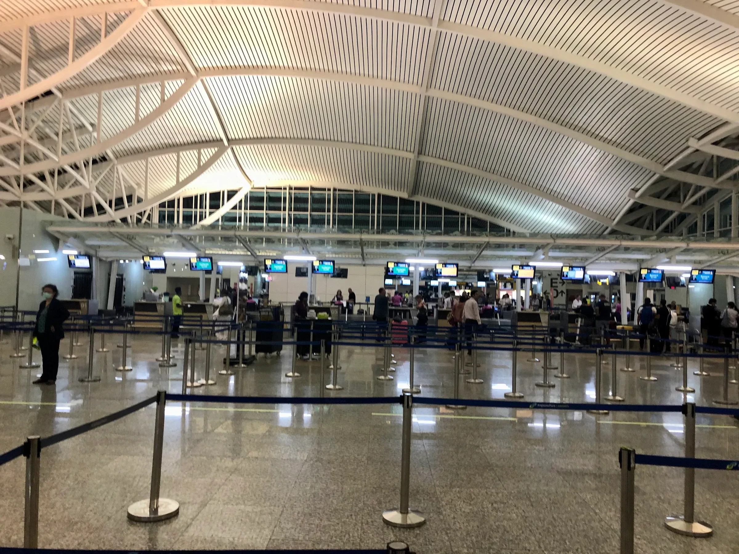 Immigration counters in the arrivals hall at Ngurah Rai airport, Bali