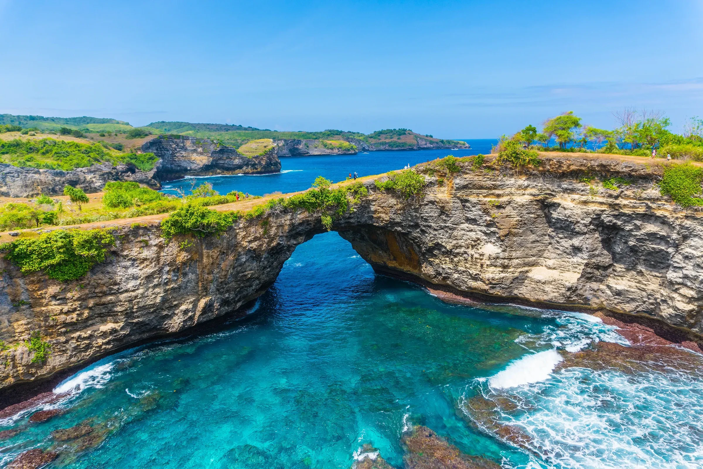 The rock arch and turquoise cove at Broken Beach on Nusa Penida