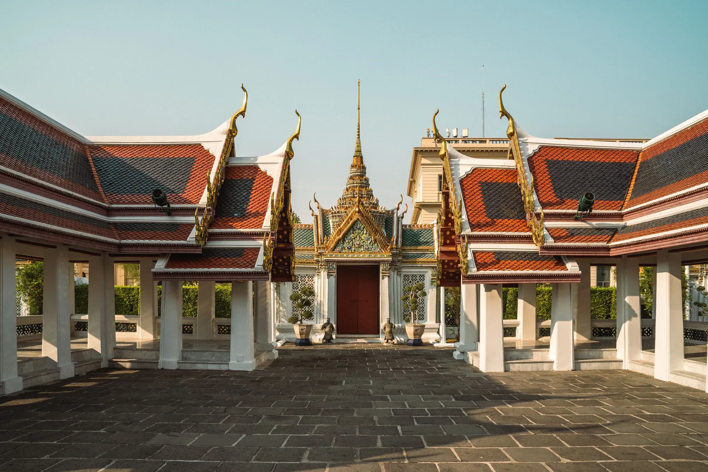 Temple pavilions and a spire inside the Grand Palace complex in Bangkok