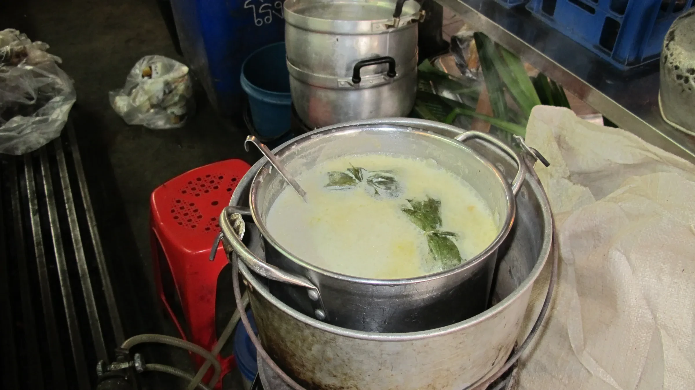 A pot of coconut soup on a street stall at a Chiang Mai market