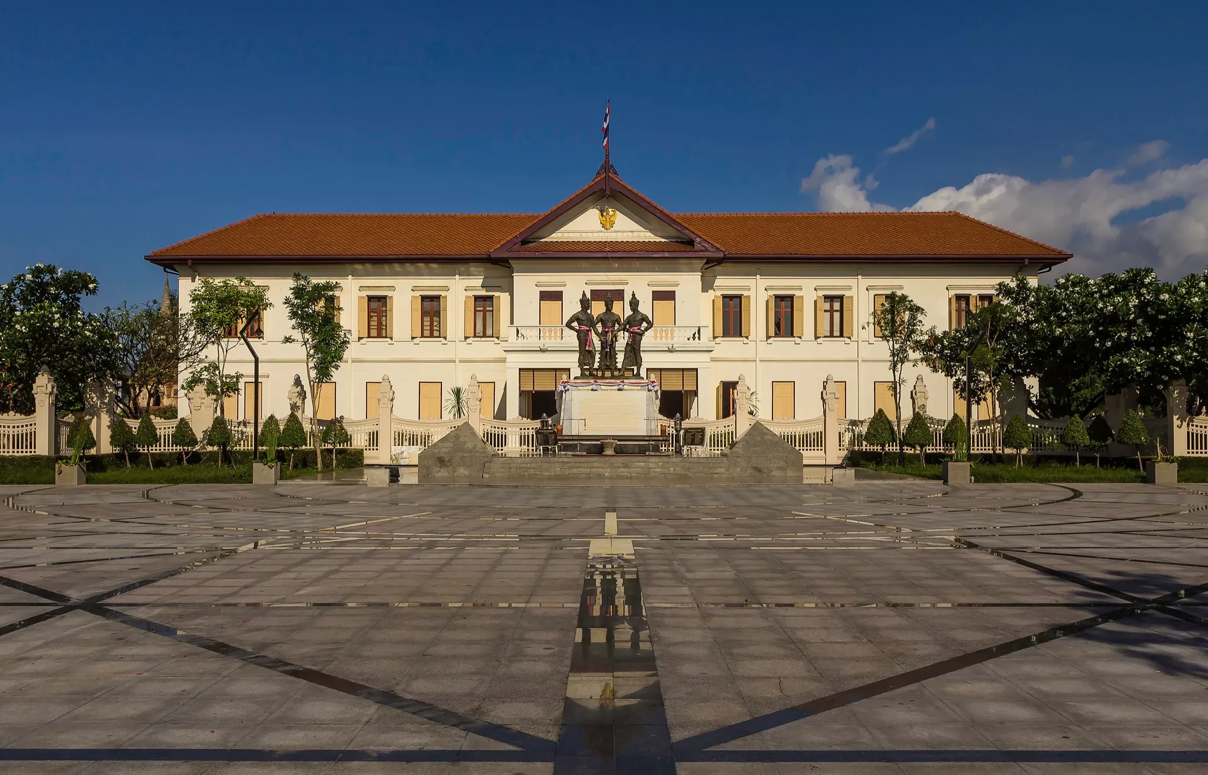 The Chiang Mai City Art and Cultural Center and the Three Kings Monument in the Old City at dusk