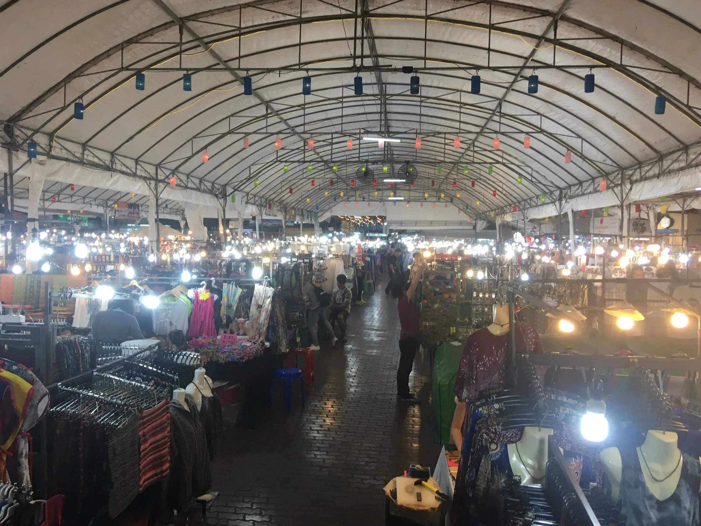 Covered stalls at the Chiang Mai Night Bazaar in the evening