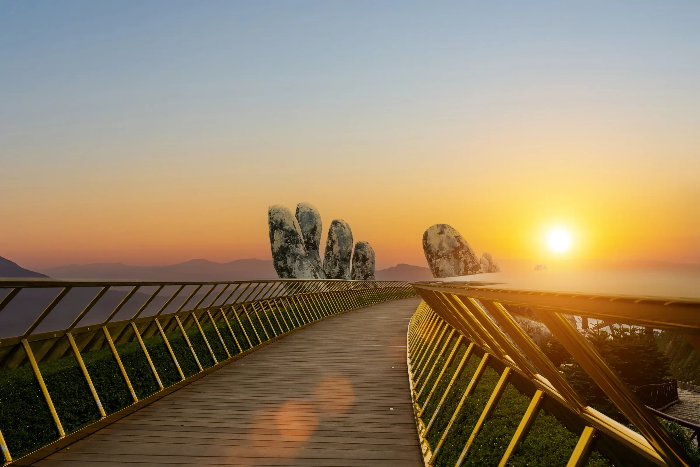 The Golden Bridge held up by giant stone hands at Ba Na Hills