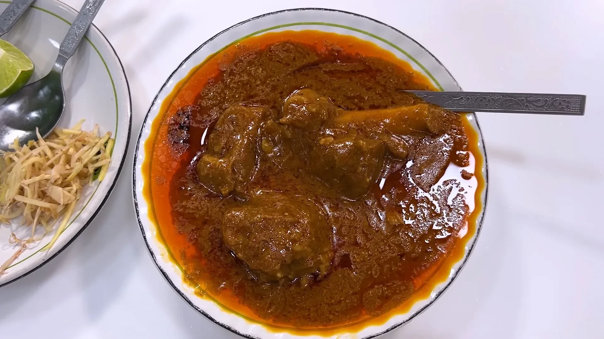 A bowl of nihari, a slow-cooked mutton stew, served at Karim's near Jama Masjid