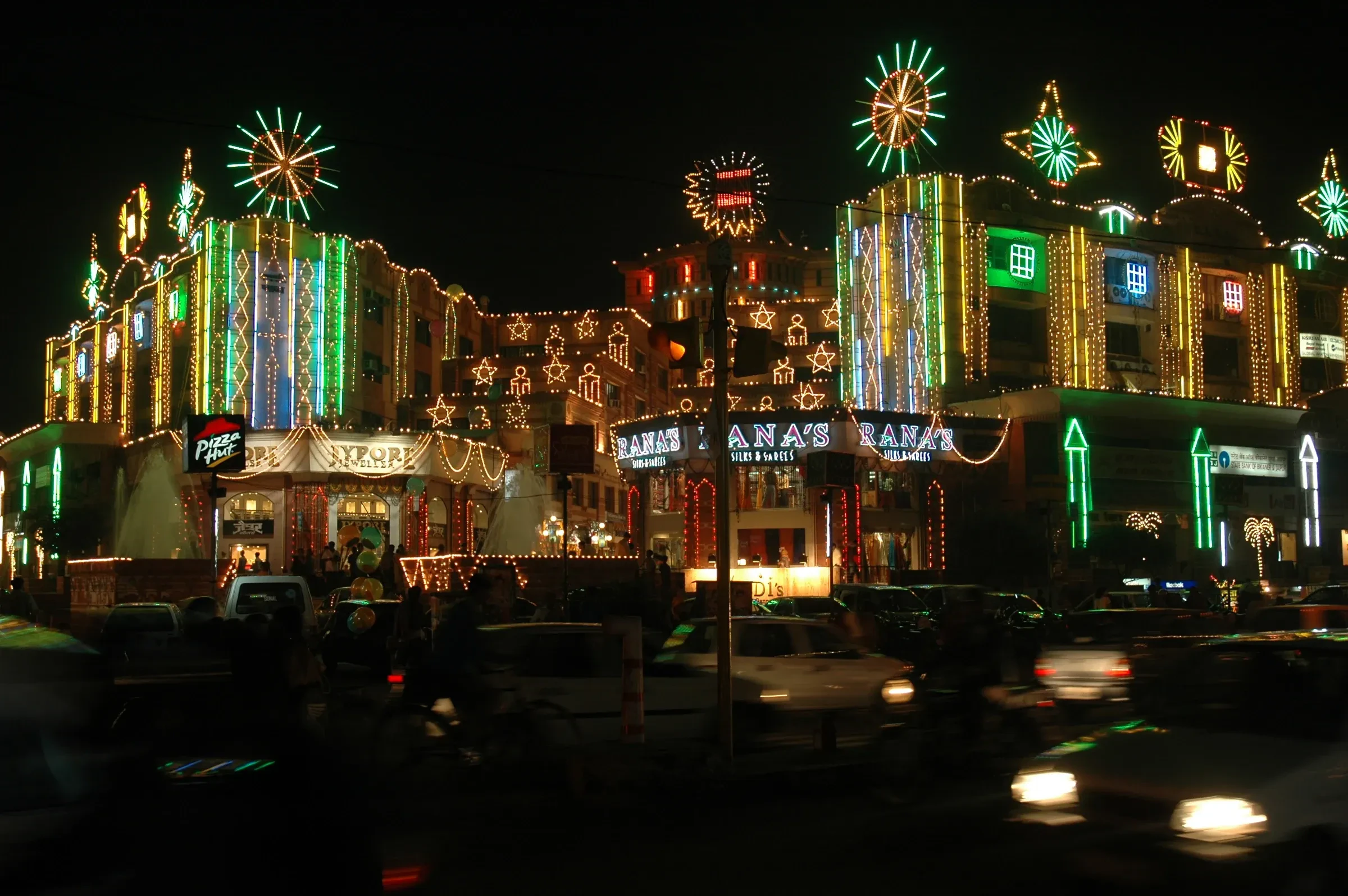 Shopfronts and street decorations covered in coloured lights in Jaipur during Diwali
