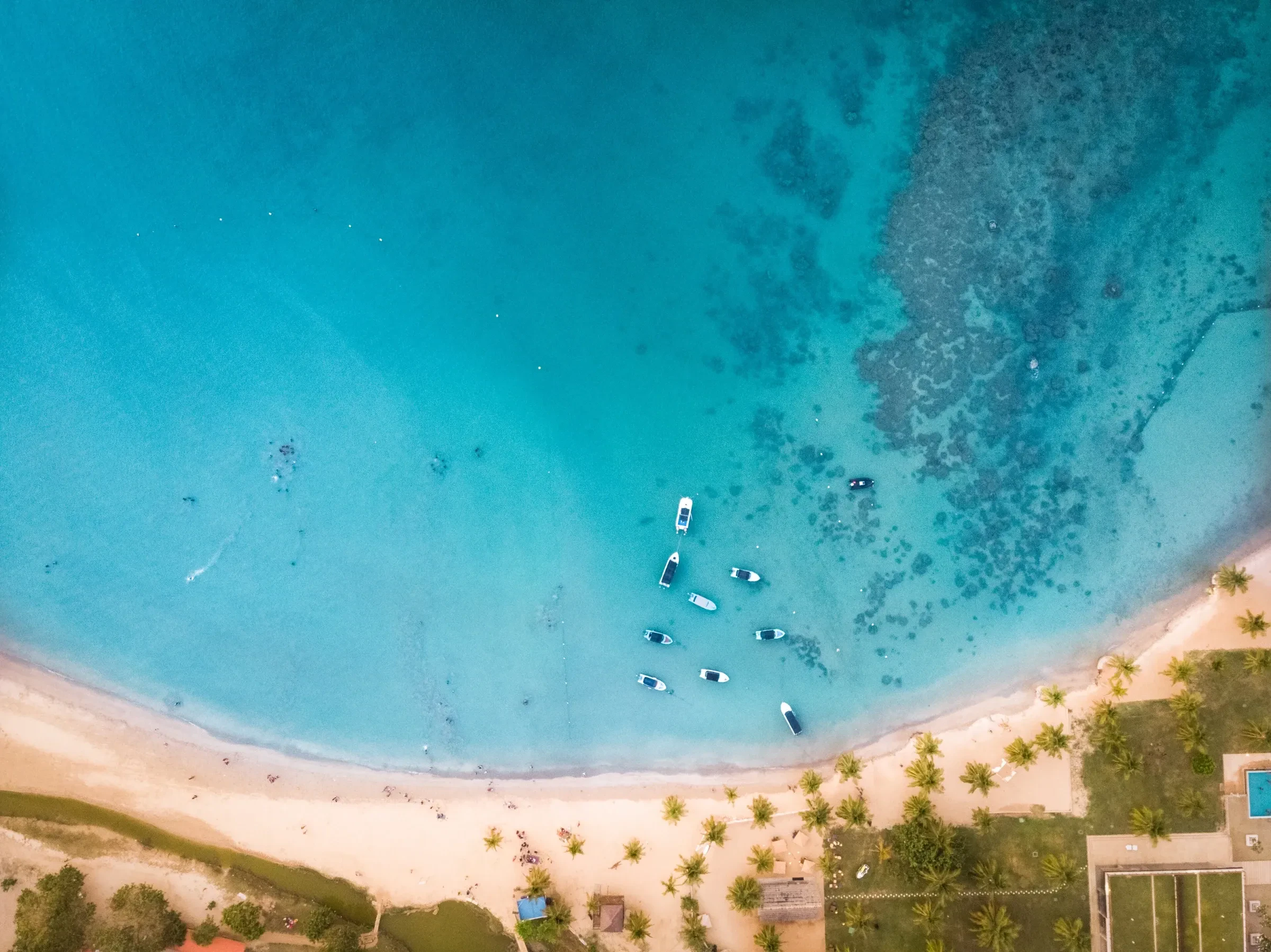 Aerial view of Pasikudah's calm turquoise bay and sandy shore