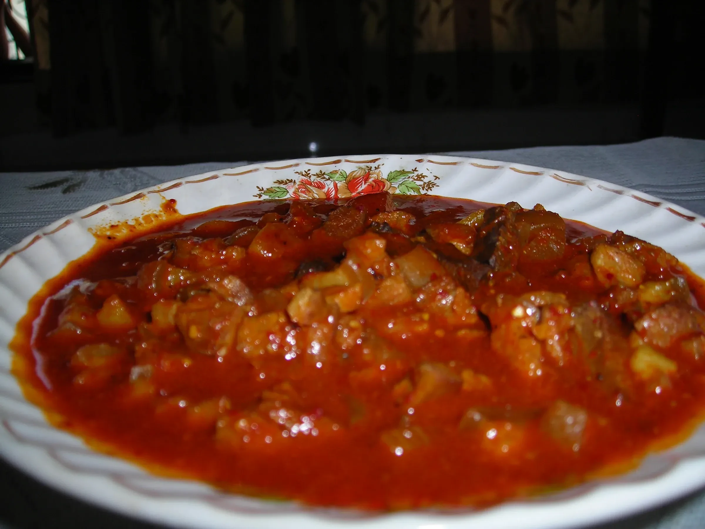 Pork sorpotel served in a shallow bowl