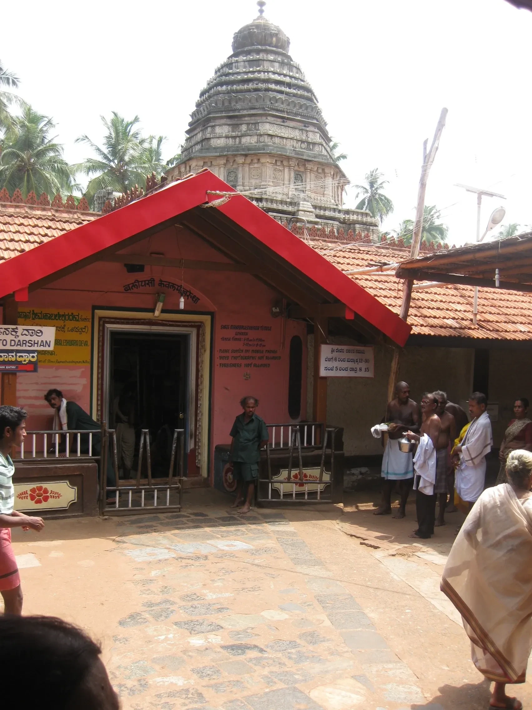 The entrance courtyard of Mahabaleshwar Temple in Gokarna, with its tower behind