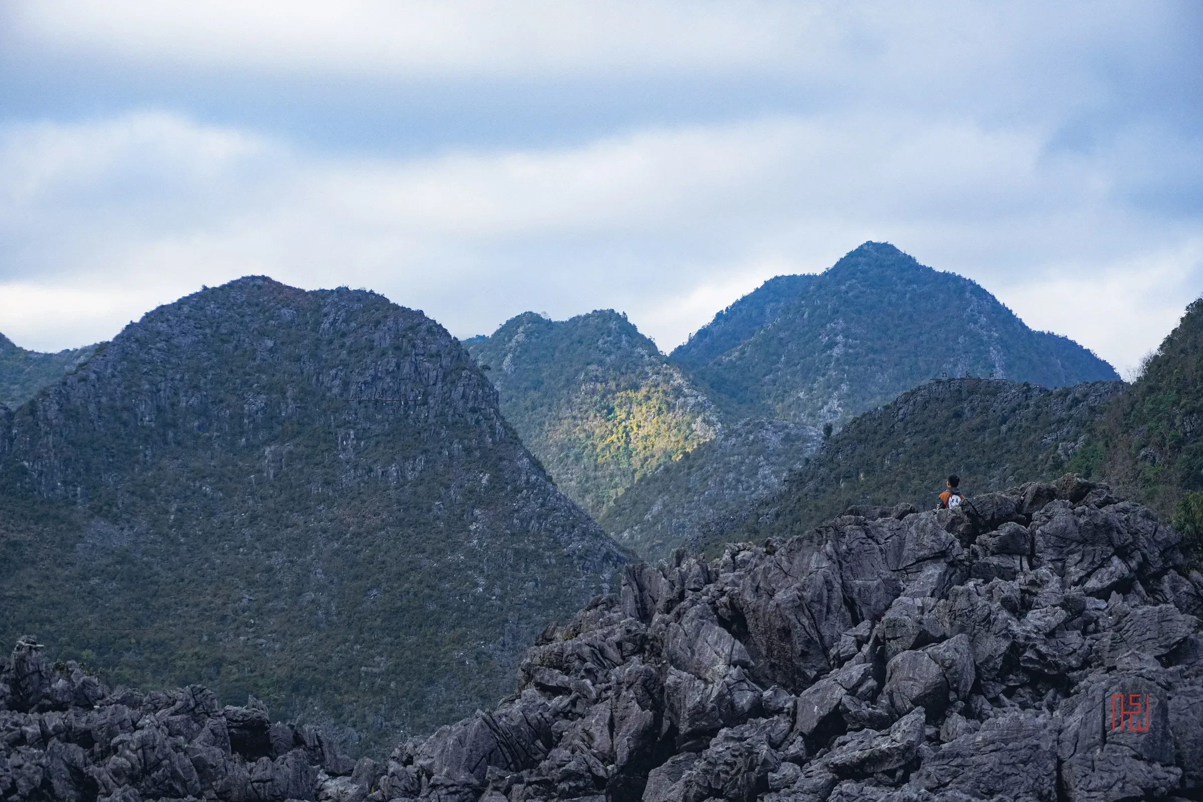 Grey limestone rocks and rounded peaks on the Dong Van karst plateau in Ha Giang.