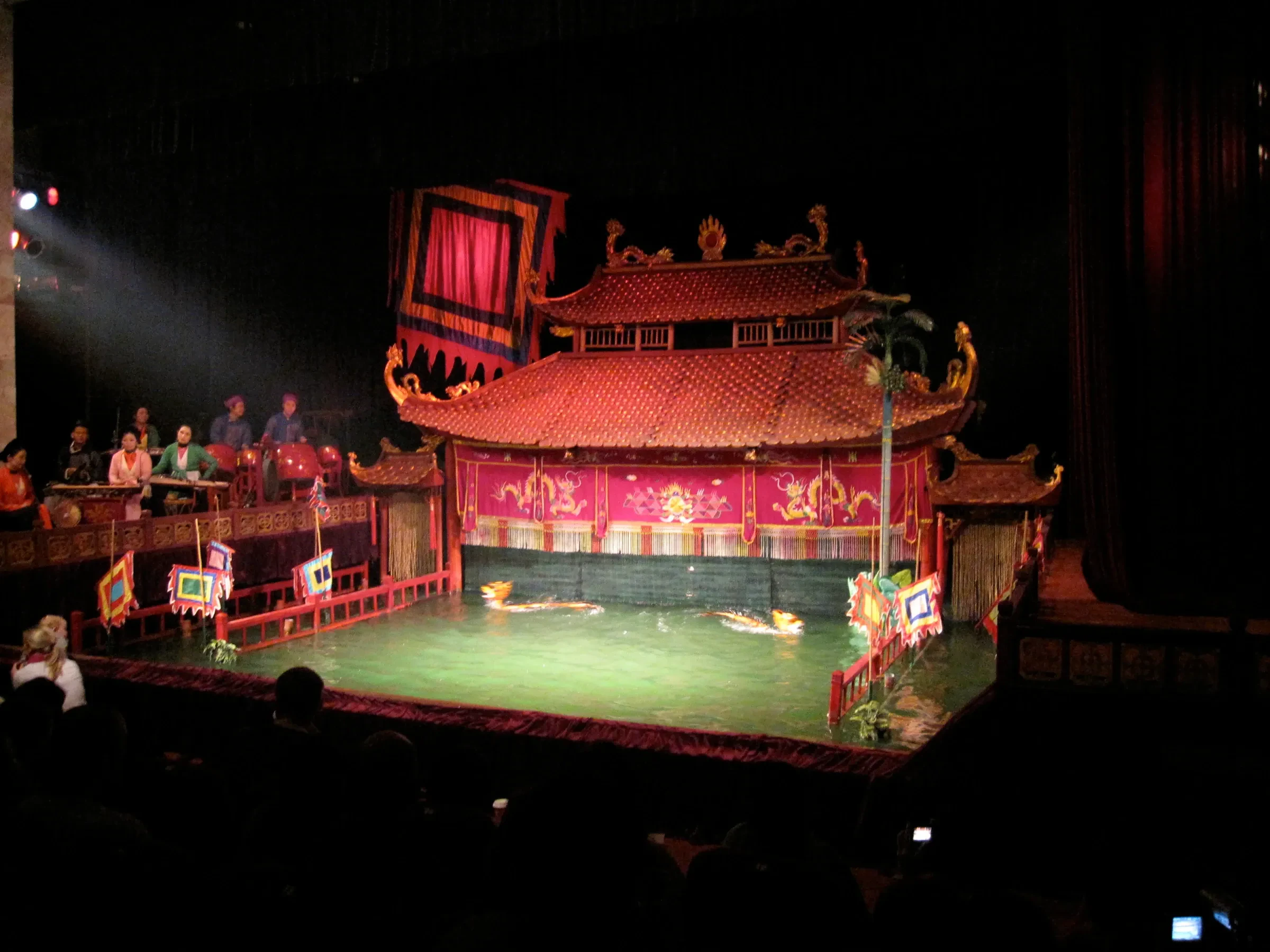 The stage of the Thang Long Water Puppet Theatre in Hanoi, with its red pavilion over the pool