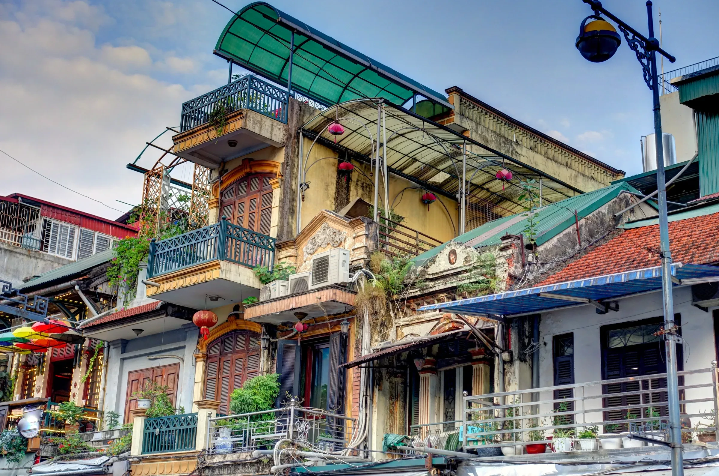Old Quarter buildings with balconies and awnings in Hanoi
