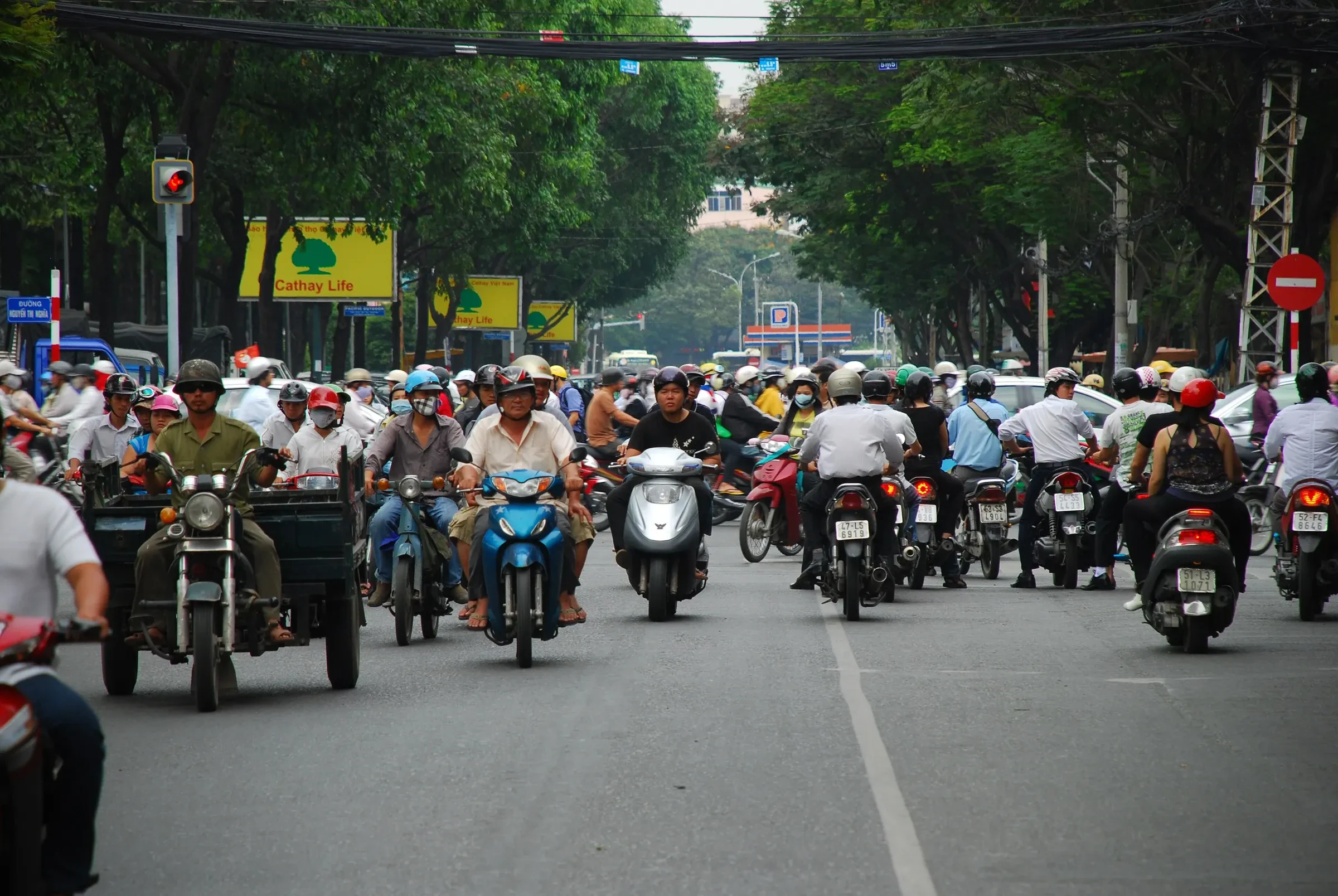 Motorbikes filling Pham Ngu Lao street in Ho Chi Minh City's backpacker area during the day