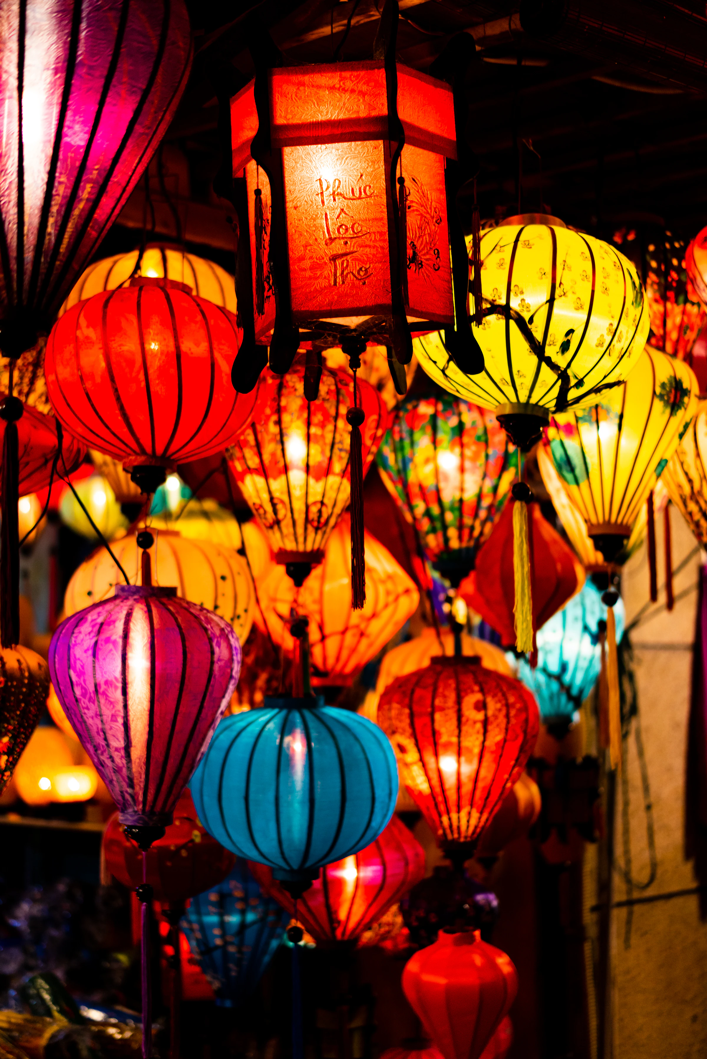 Traditional lanterns lit up in Hoi An's old town at night