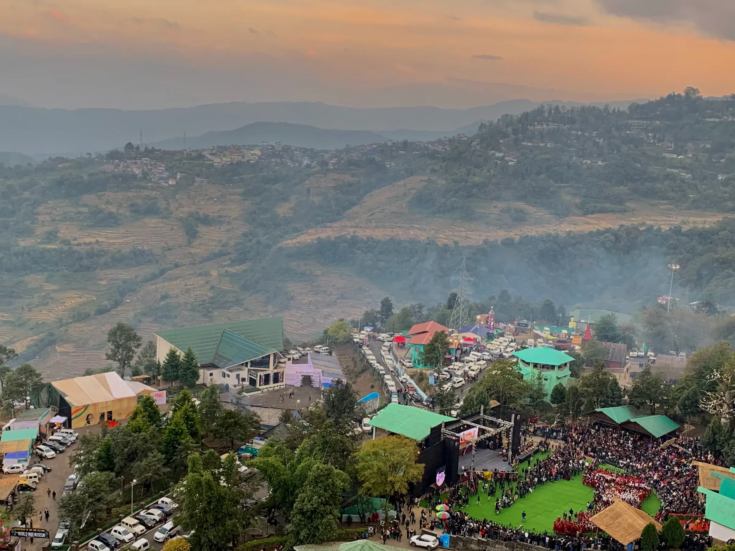 Aerial view of the crowd and stalls around the main arena at Kisama, in the Nagaland hills