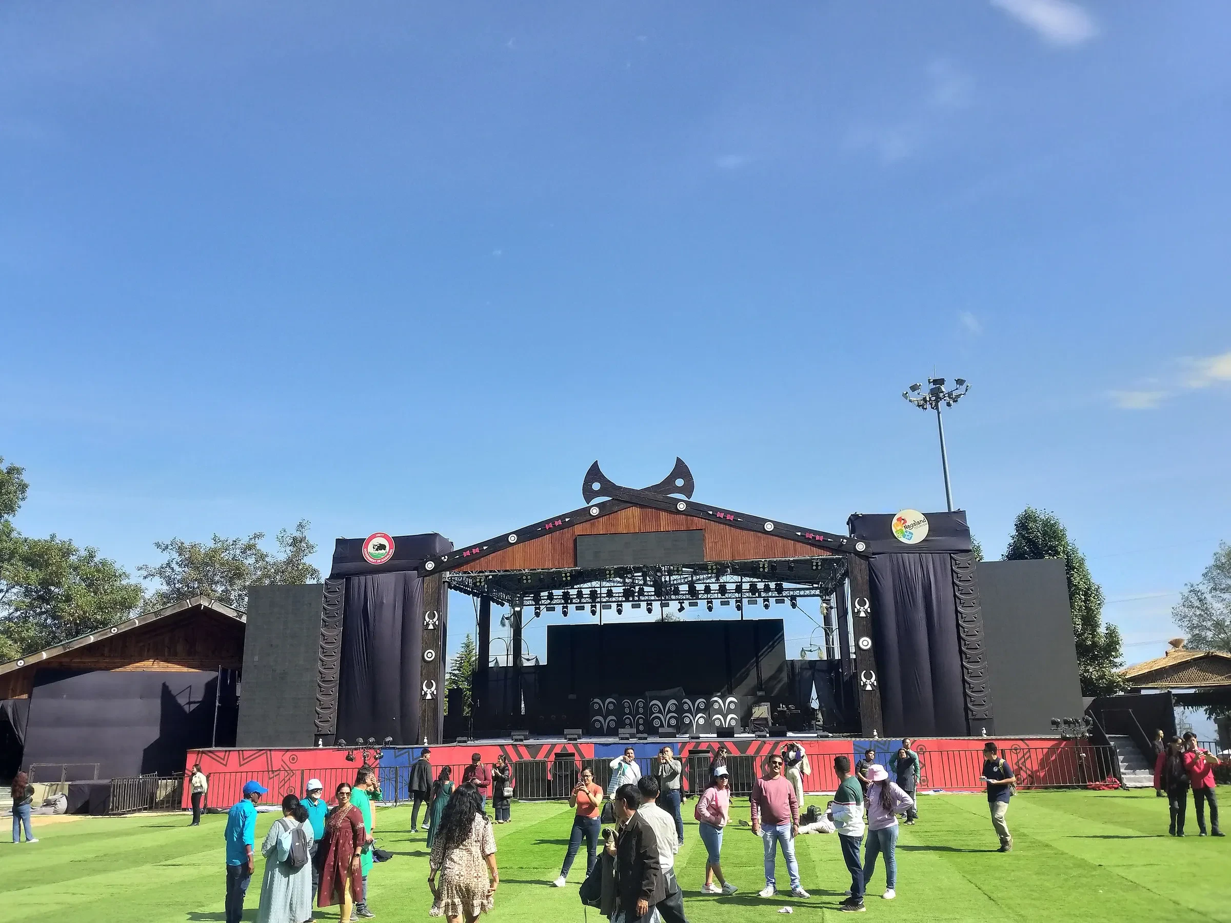 The main stage and lawn at the Hornbill Festival in Kisama on a sunny day