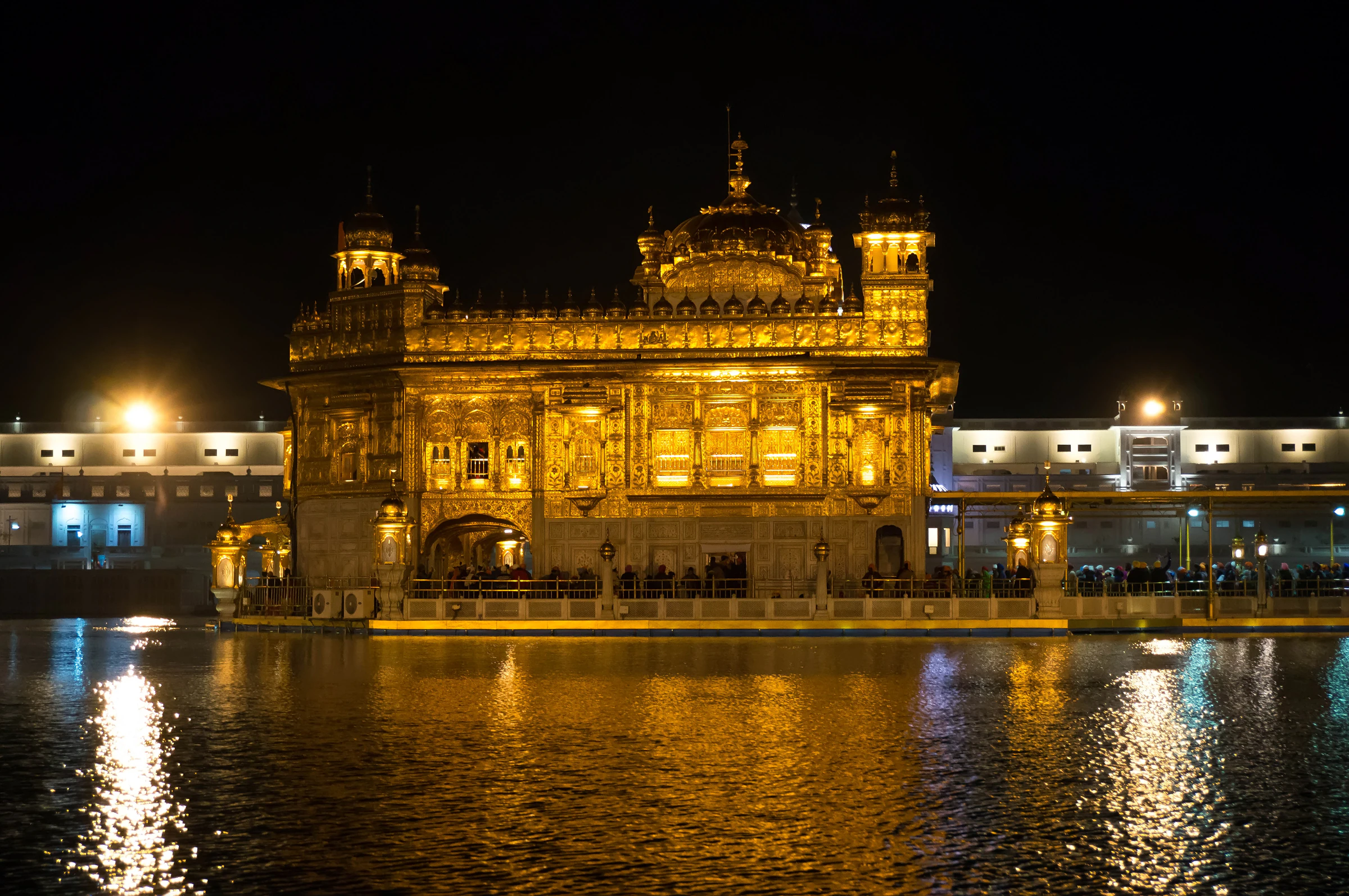 The Golden Temple's golden dome reflected in the Amrit Sarovar at dawn