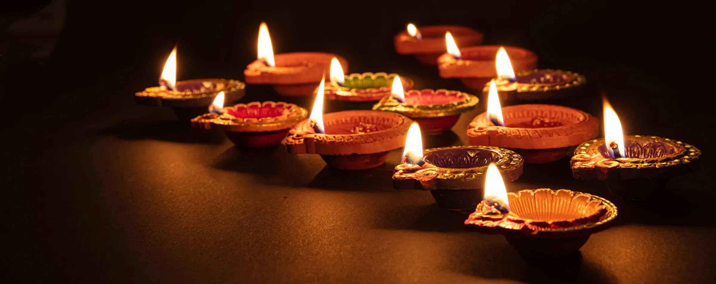 Clay oil lamps lit for Diwali, the festival of lights.