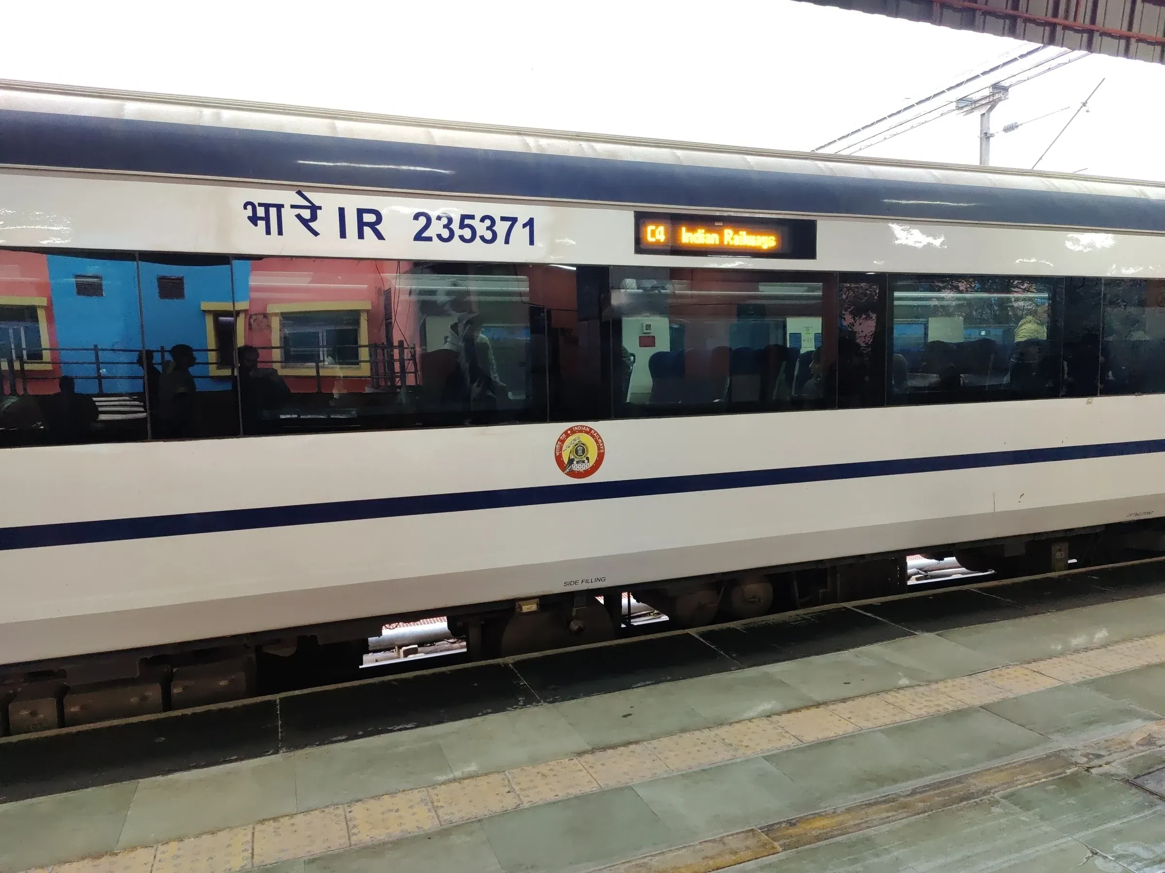 A Vande Bharat Express train standing at a platform in India