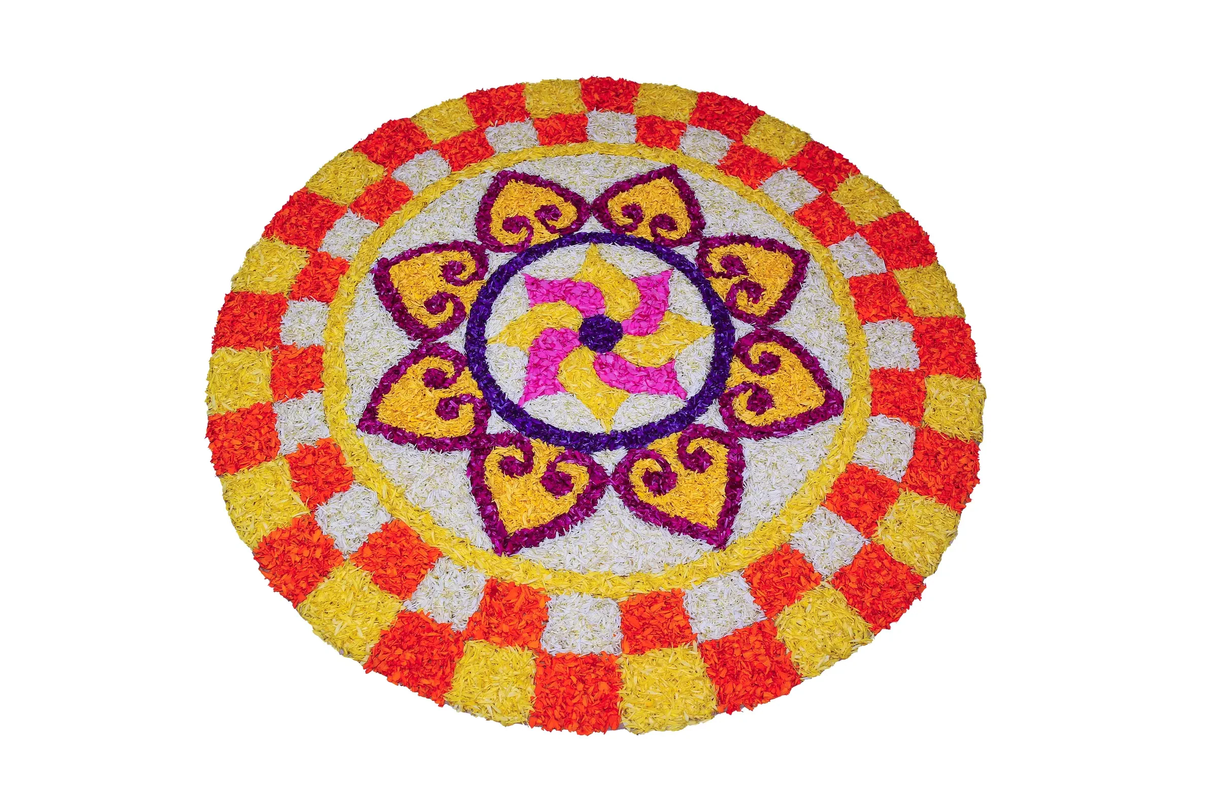 A flower carpet (pookalam) laid out in a courtyard during Kerala's Onam festival