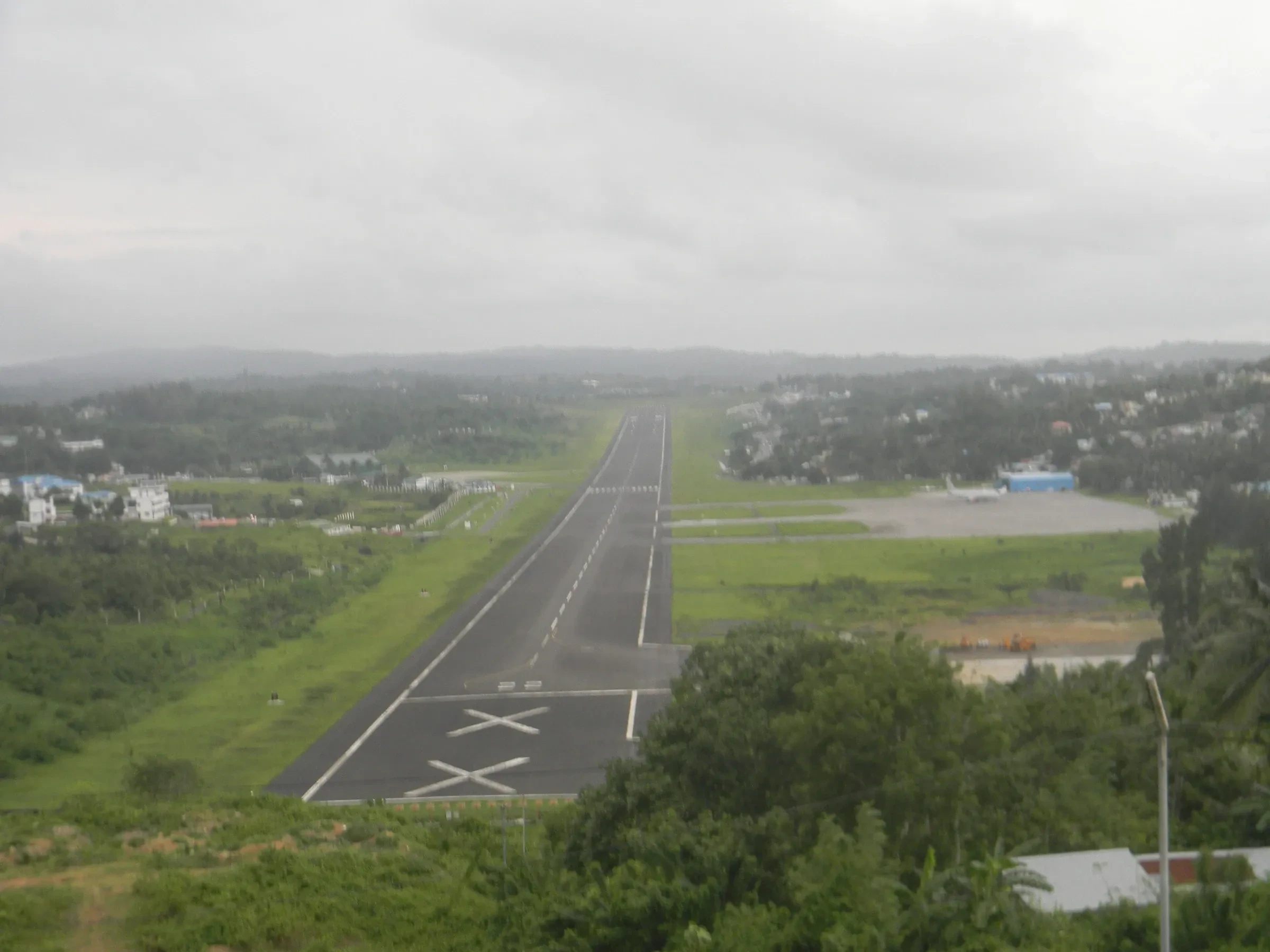 The runway at Port Blair airport seen from a park above it