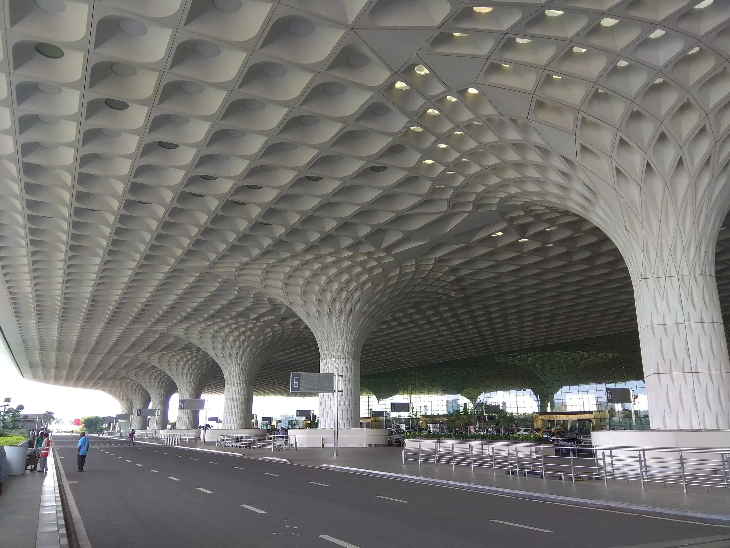 The patterned concrete canopy outside departures at Mumbai's international airport