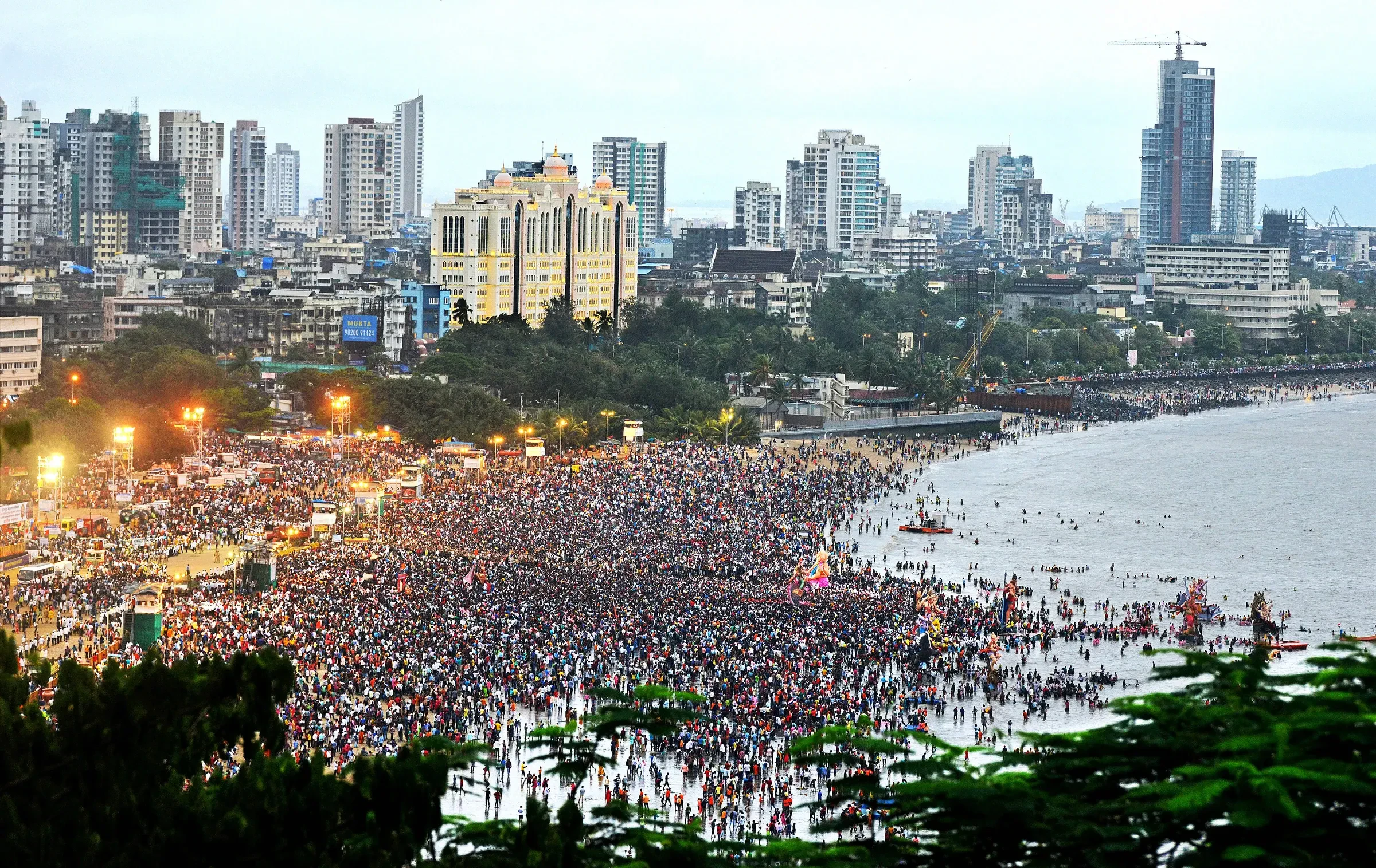 Thousands of people crowding Girgaum Chowpatty beach in Mumbai for Ganpati immersion