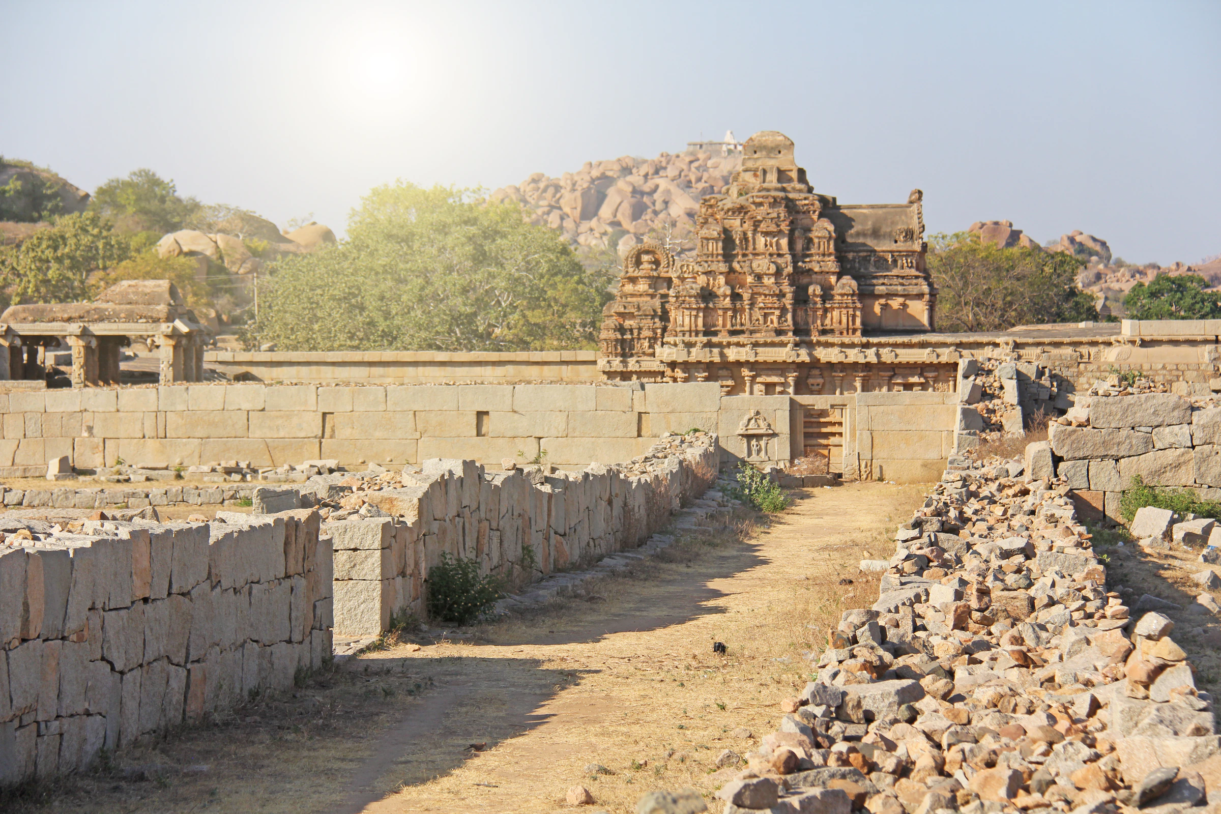 Temple stonework and walls among the boulders of Hampi