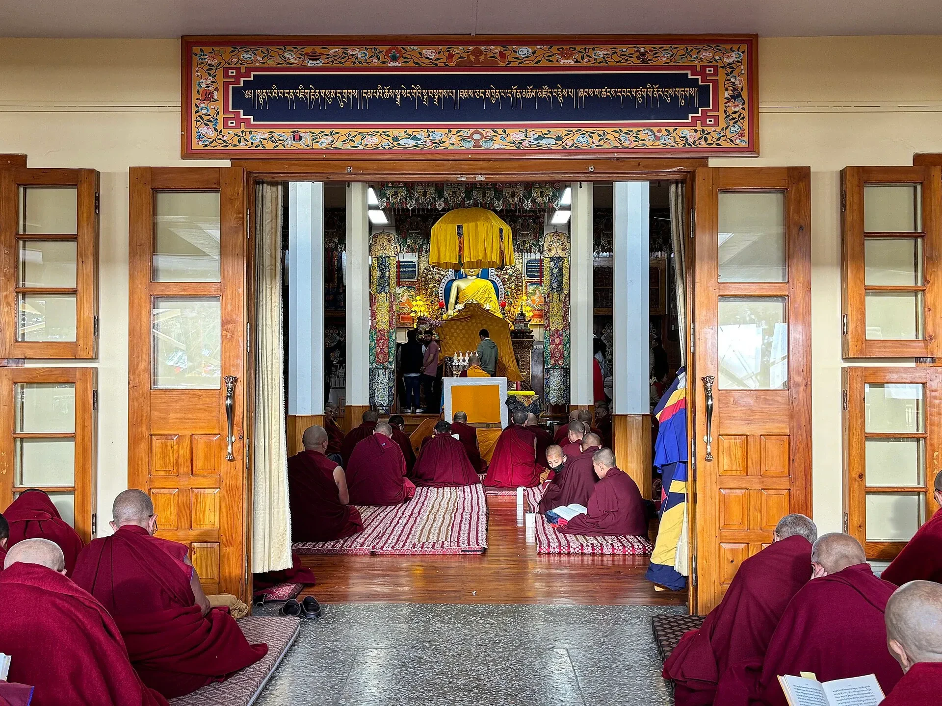 Monks gathered in the main hall of Namgyal Monastery in Dharamshala