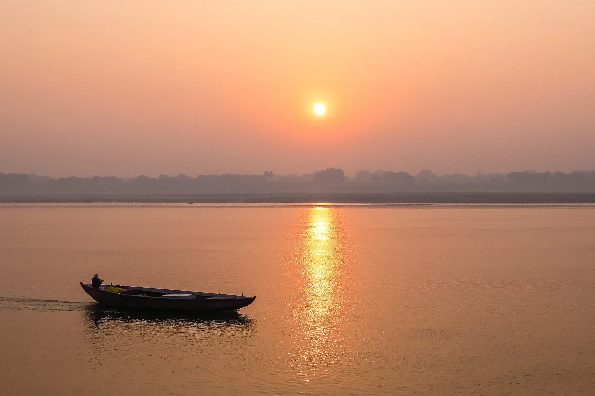 A small boat on the Ganges at sunrise, Varanasi