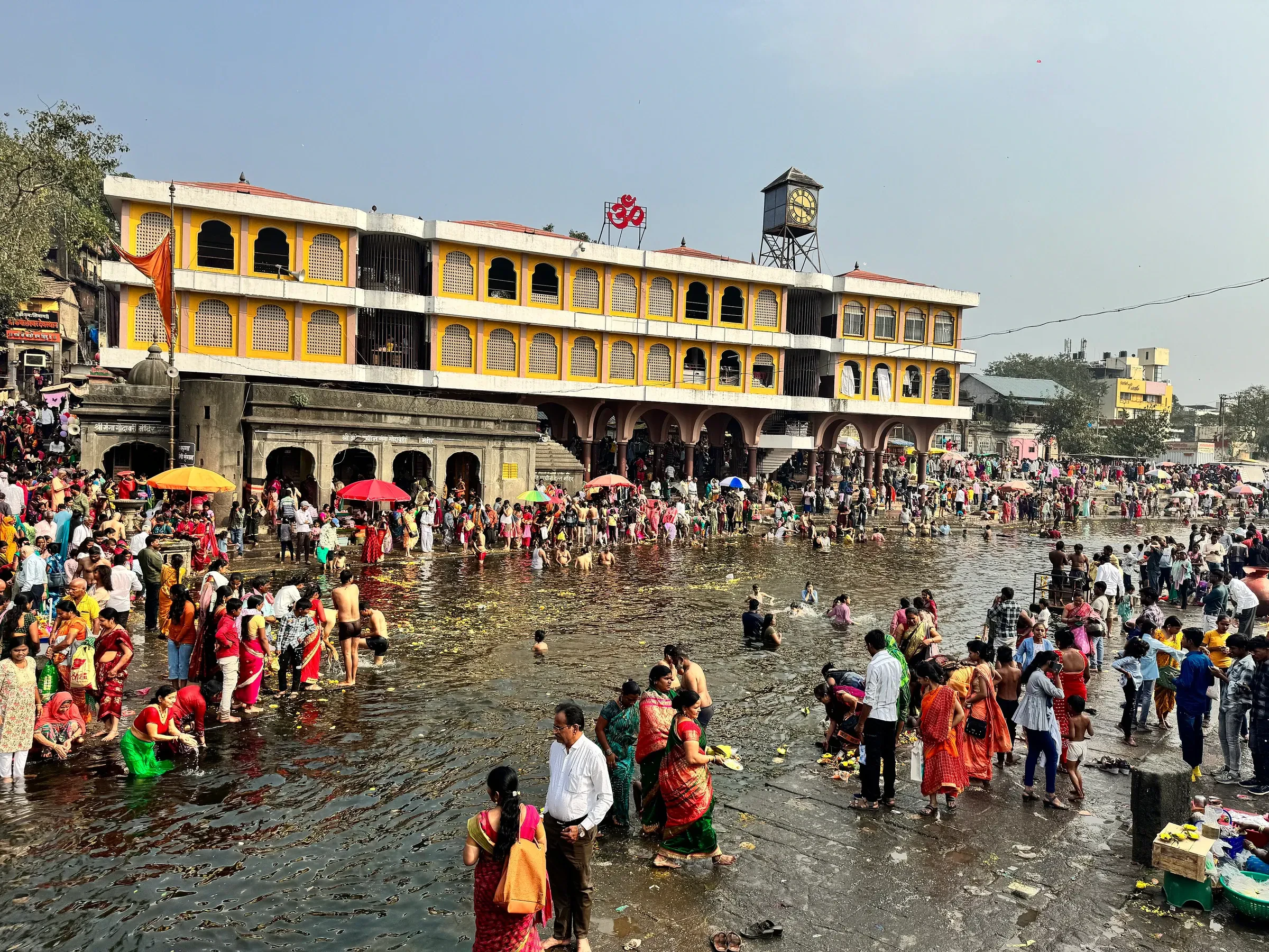 Pilgrims bathing in the Godavari at Ramkund in Nashik on Makar Sankranti