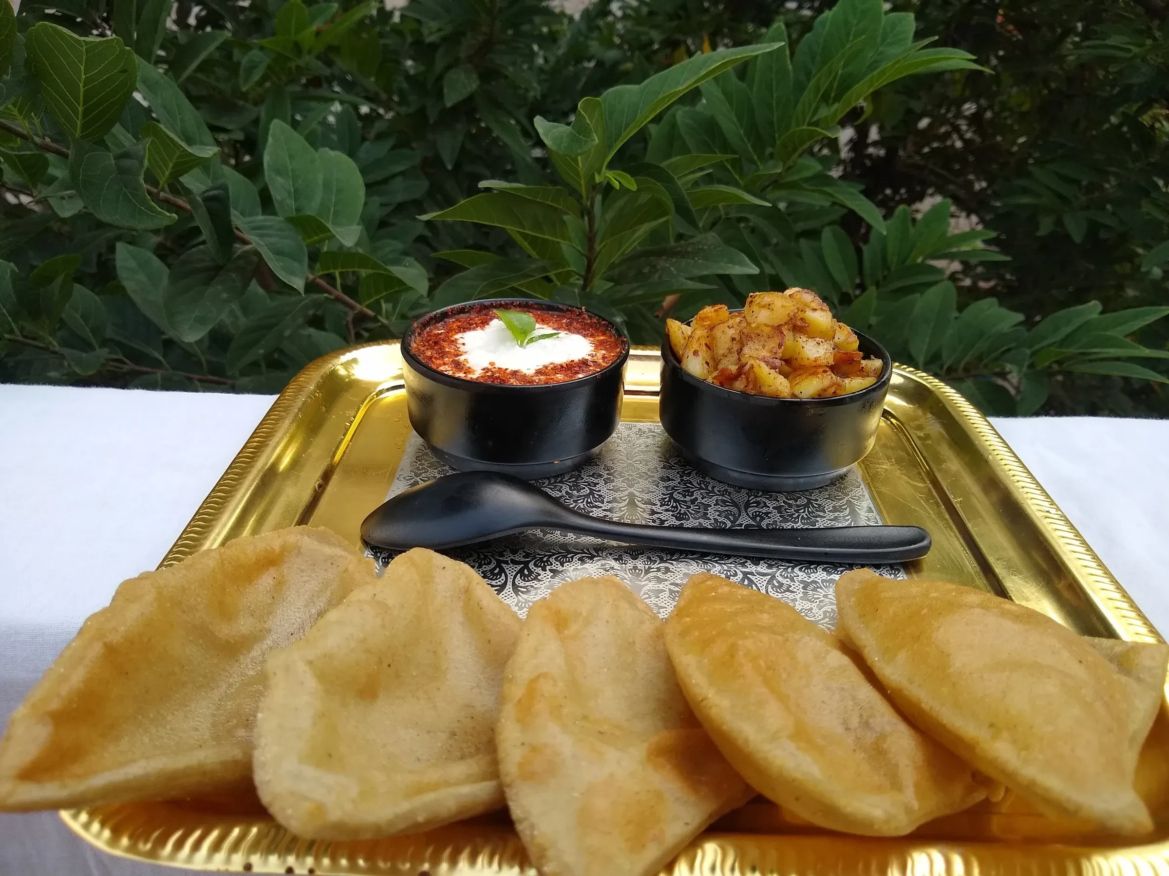A tray of kuttu puri with potato curry, a fasting dish eaten during Navratri in Gujarat
