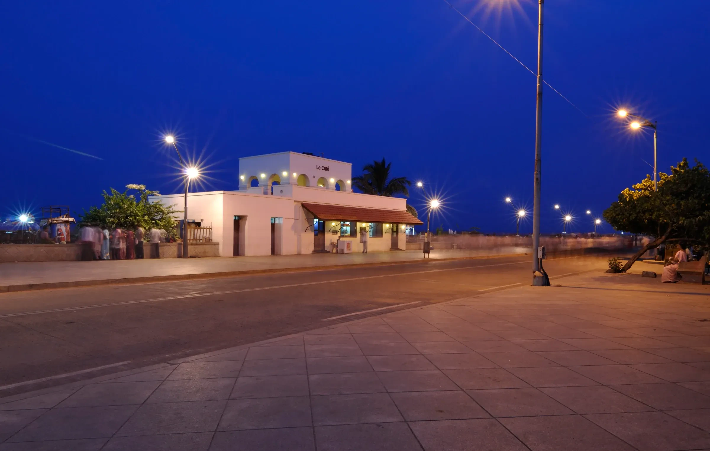 Promenade Beach road in Pondicherry at blue hour, lined with street lamps