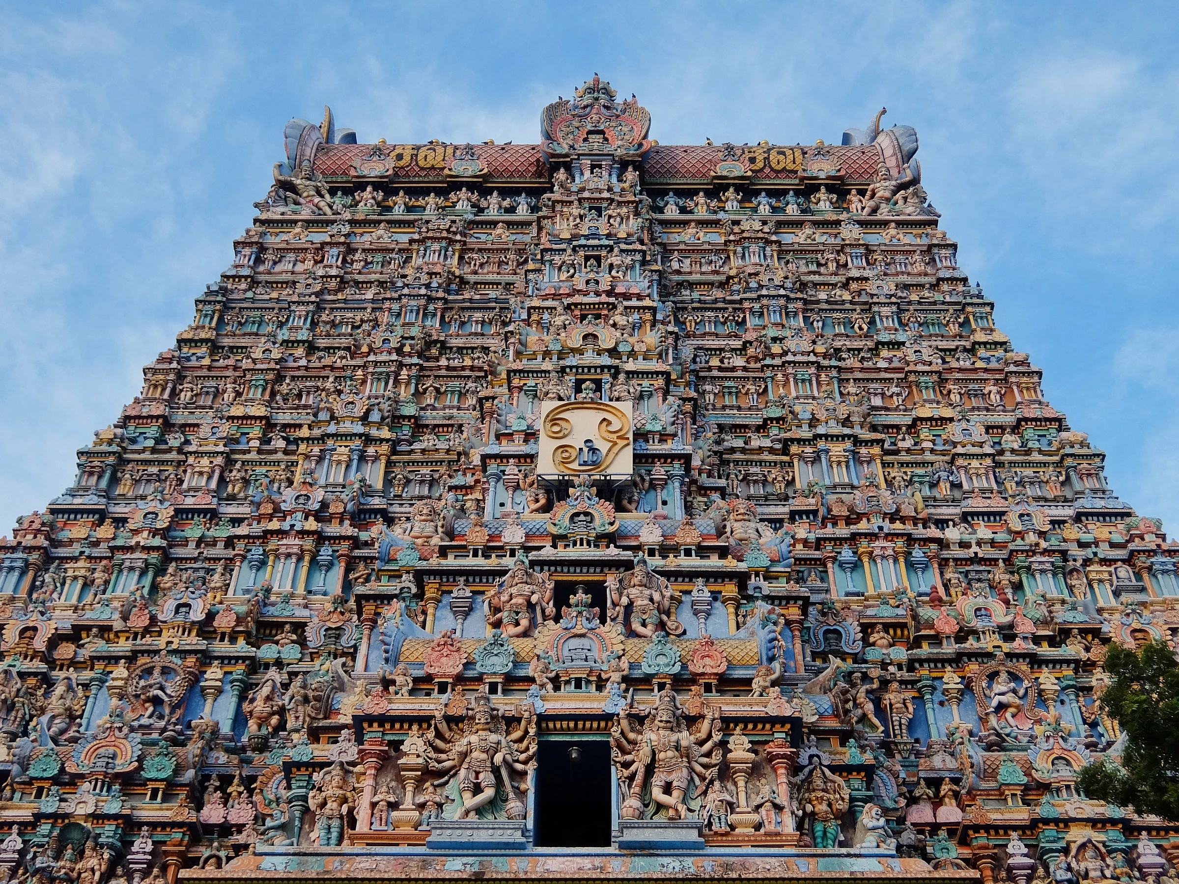 The painted towers of Meenakshi Amman Temple rising over Madurai's old city