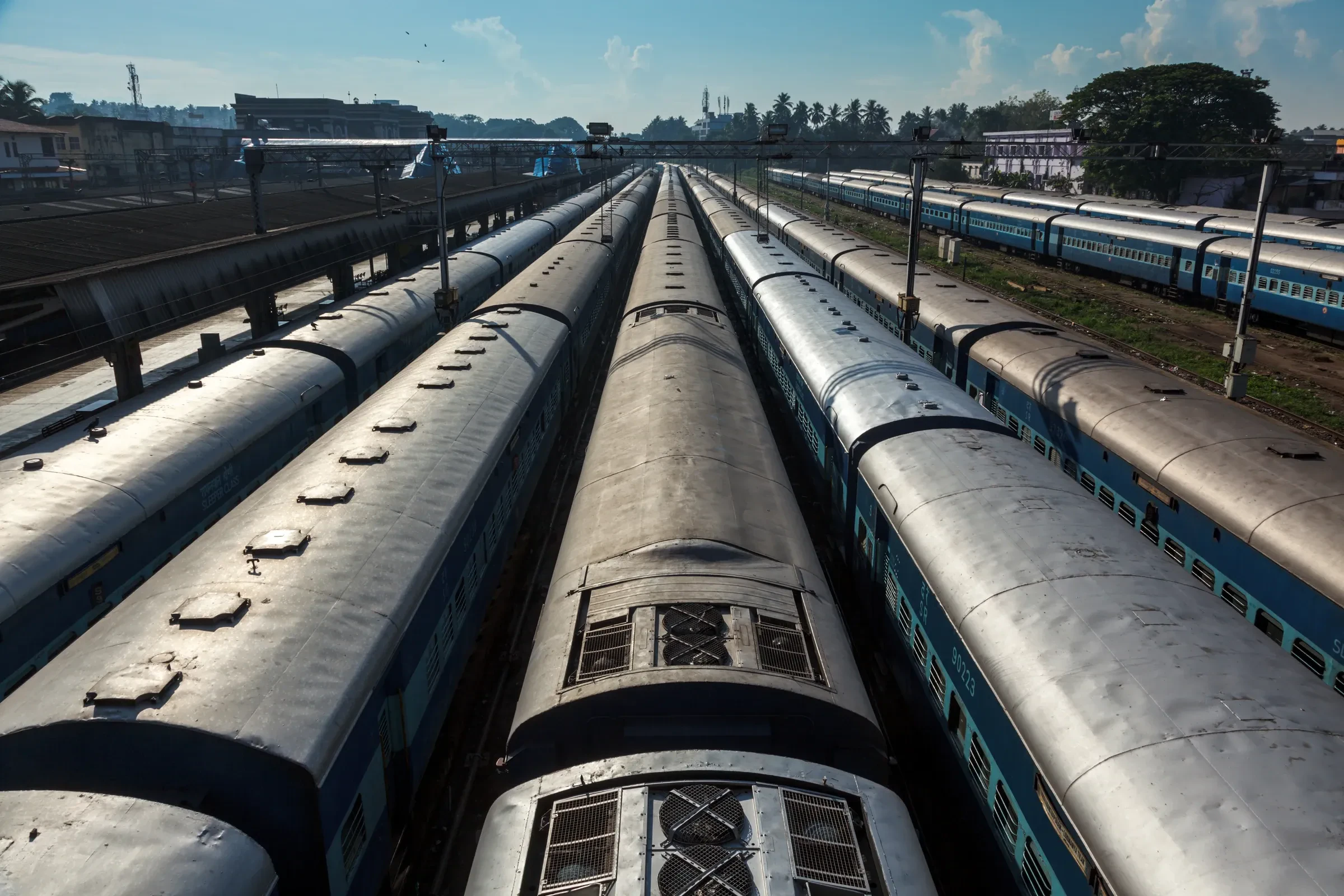 Rows of long-distance trains waiting in the station yard at Trivandrum, Kerala