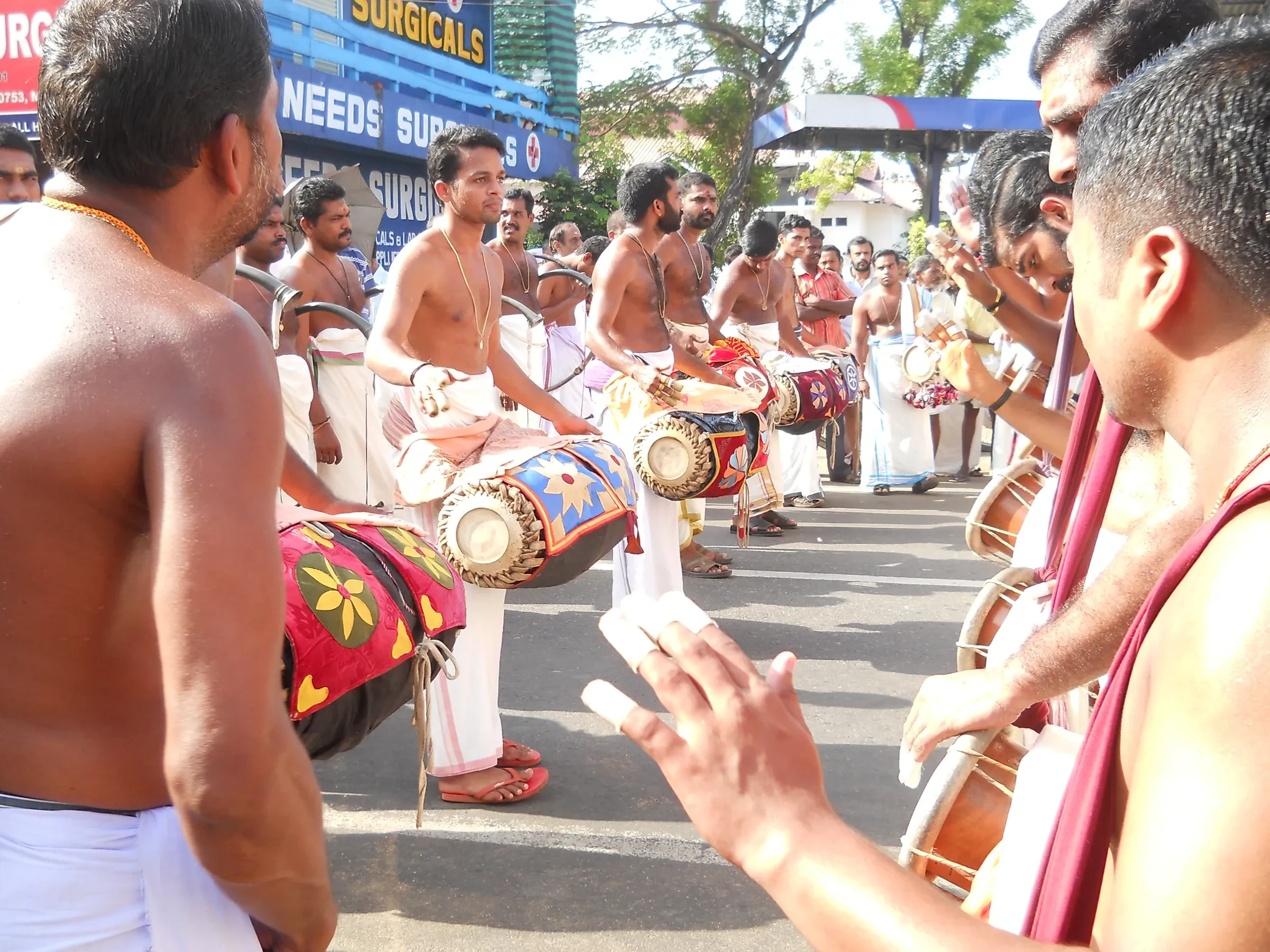 Drummers and horn players performing in the street during a past Thrissur Pooram