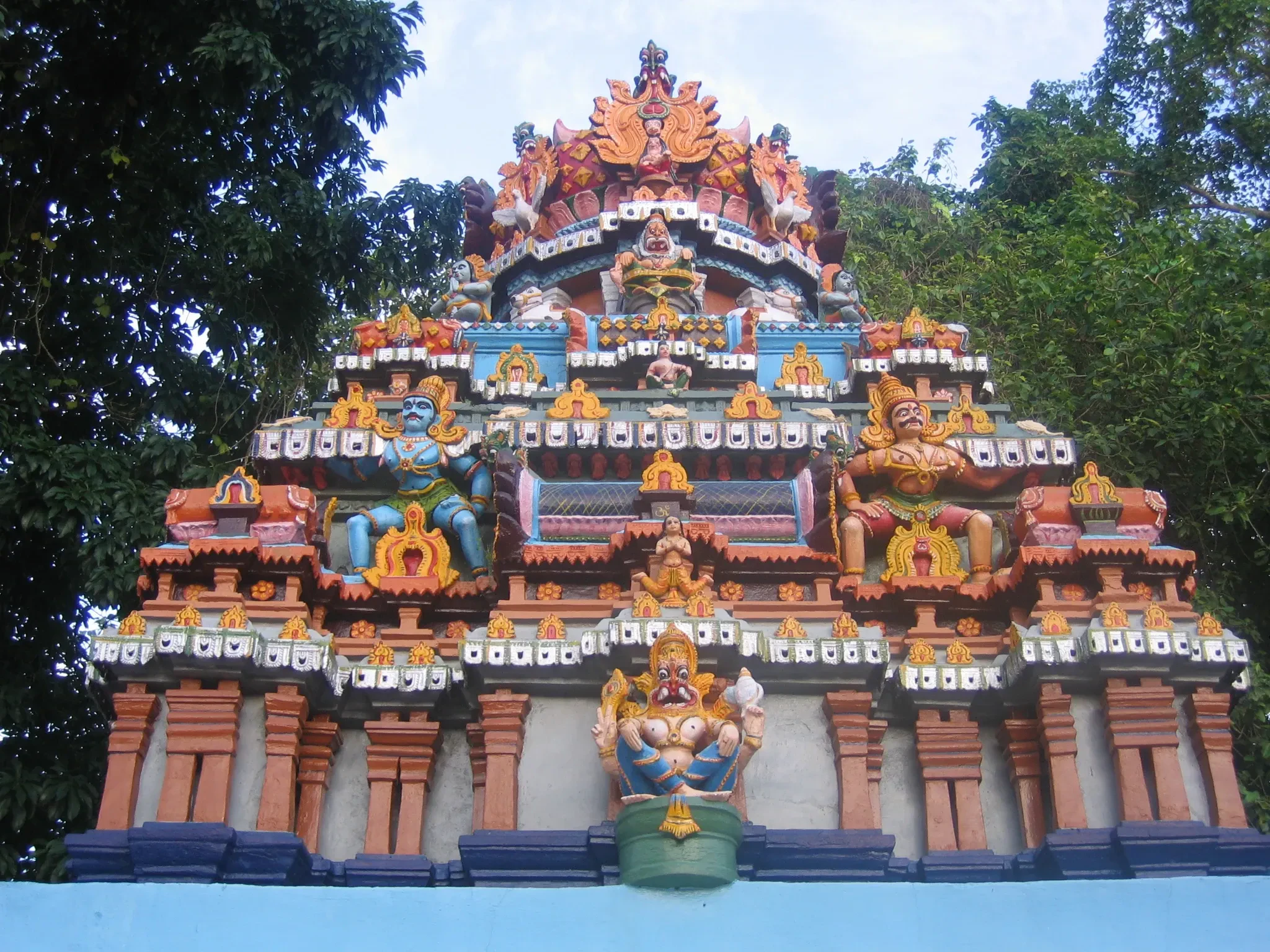 The colourful tiered tower of a small shrine at Janardanaswamy Temple, Varkala