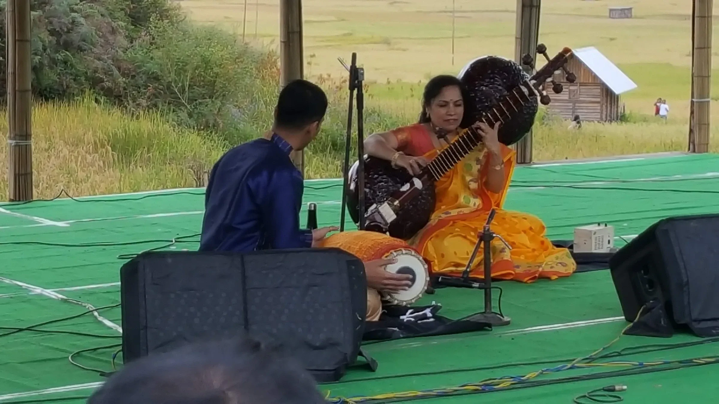 Musicians playing sitar and tabla on the day stage at the Ziro Festival of Music, 2019 edition