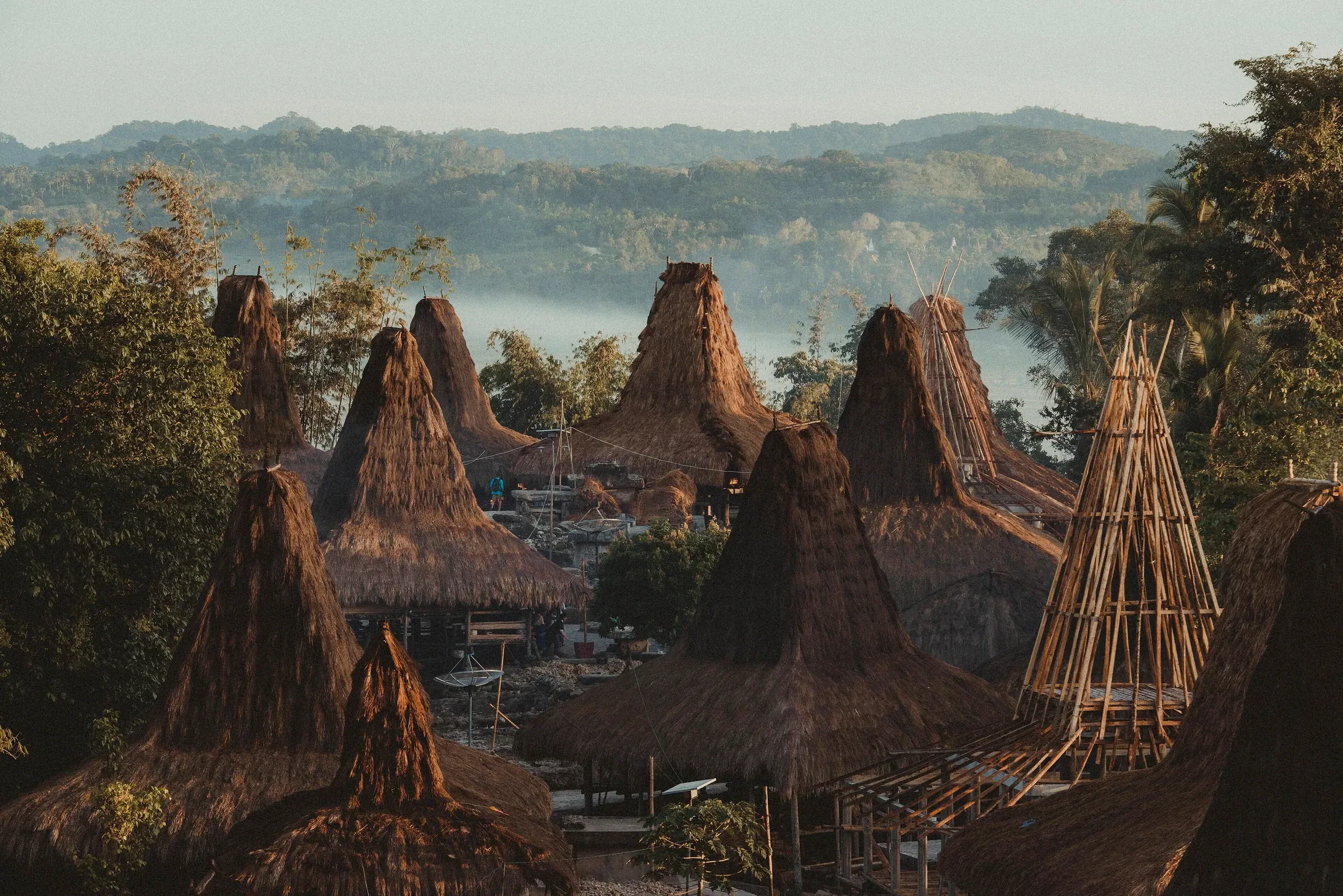 Thatched rooftops of Praijing, a traditional hilltop village in West Sumba, in early morning mist