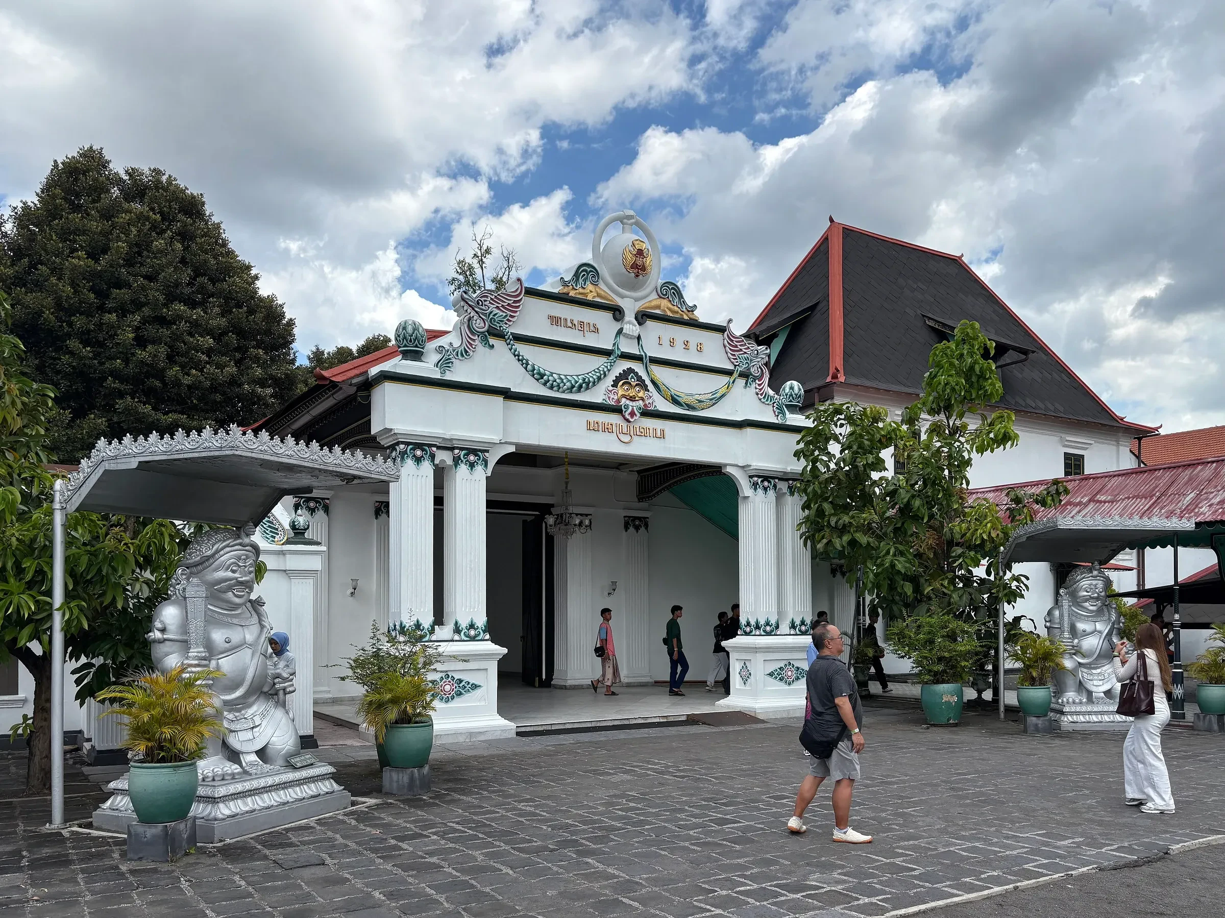 Donopratono Gate and a Dwarapala guardian statue at the Kraton, Yogyakarta