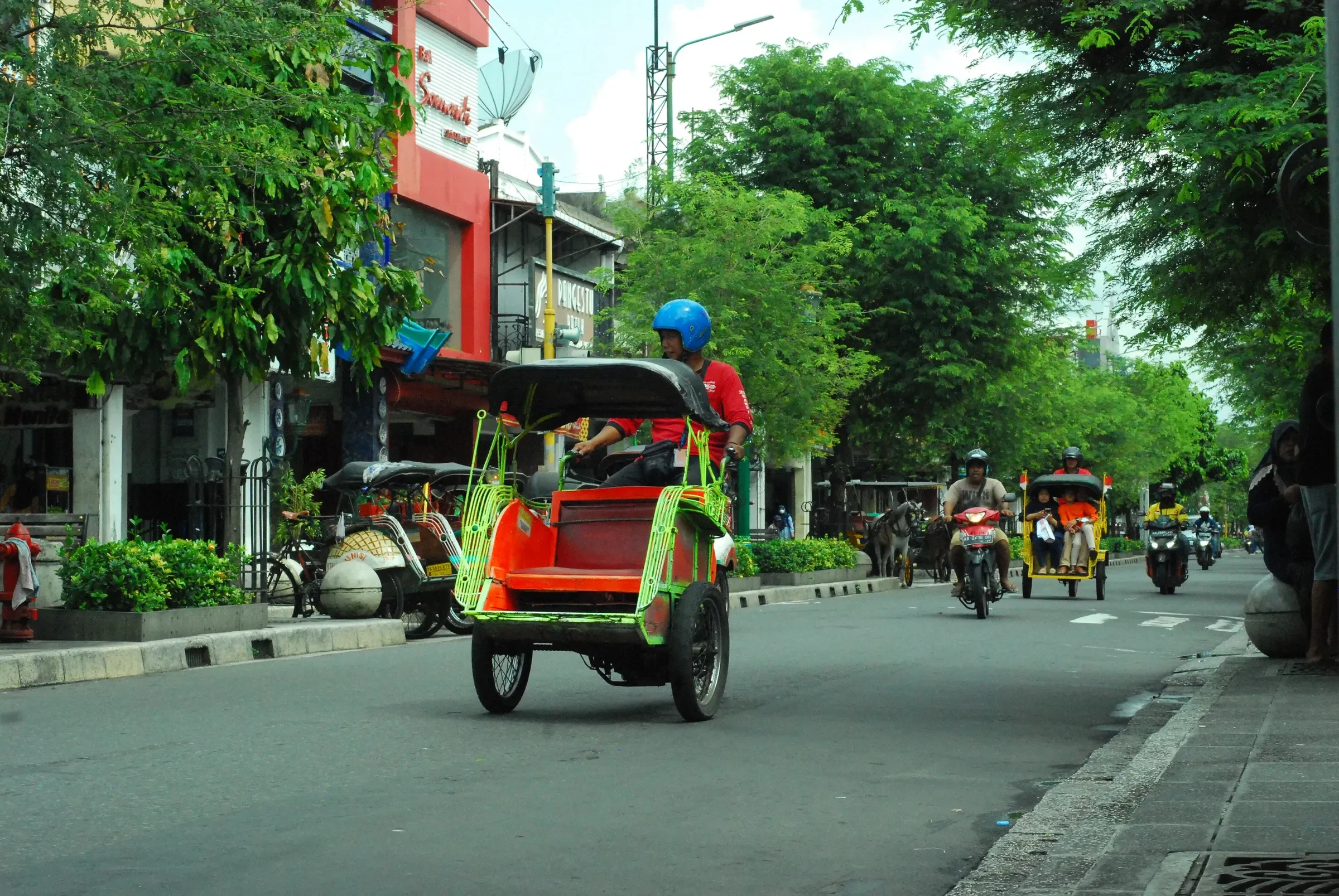 A motorised becak pedicab on Malioboro Street in Yogyakarta