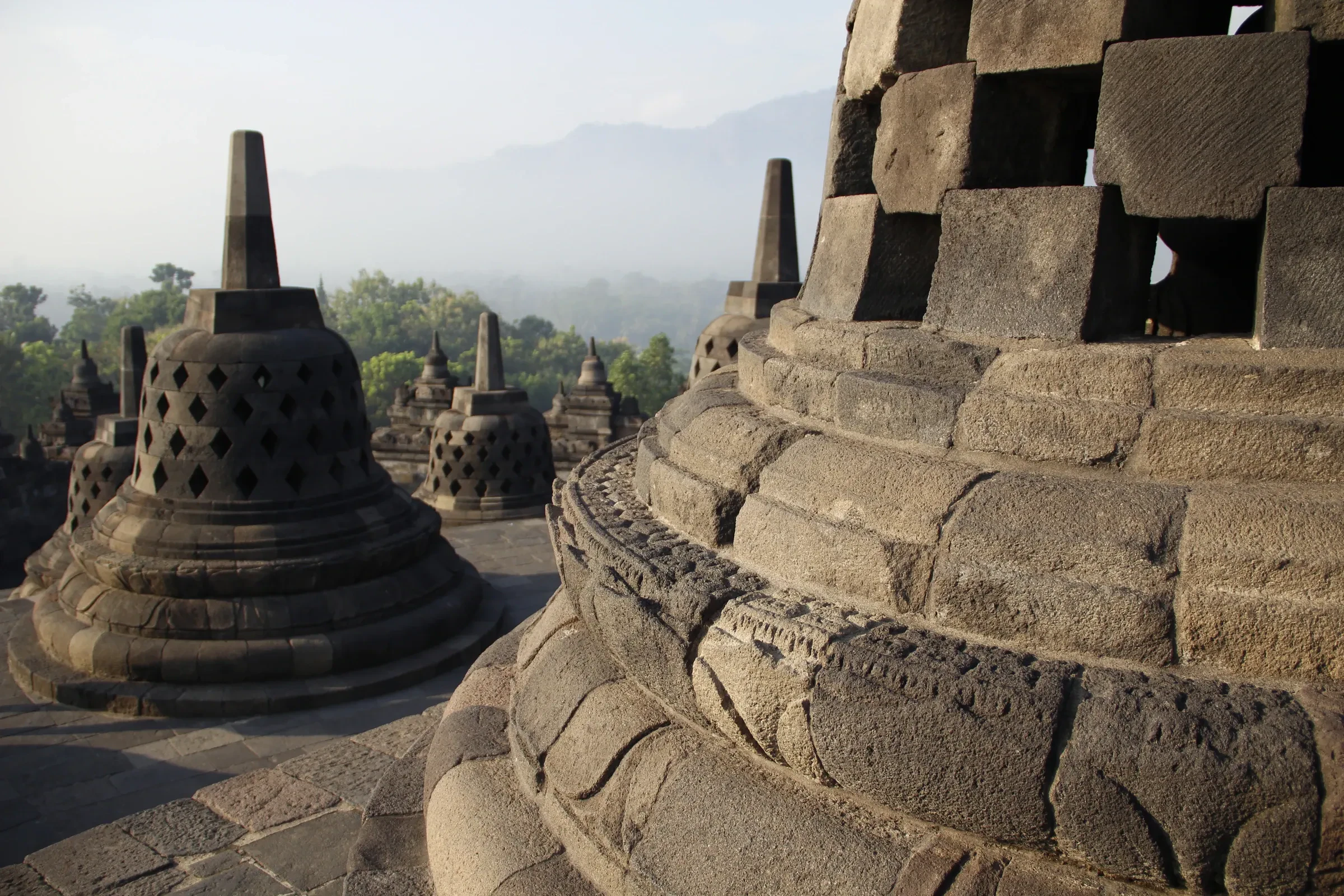 Bell-shaped stone stupas on the terraces of Borobudur temple