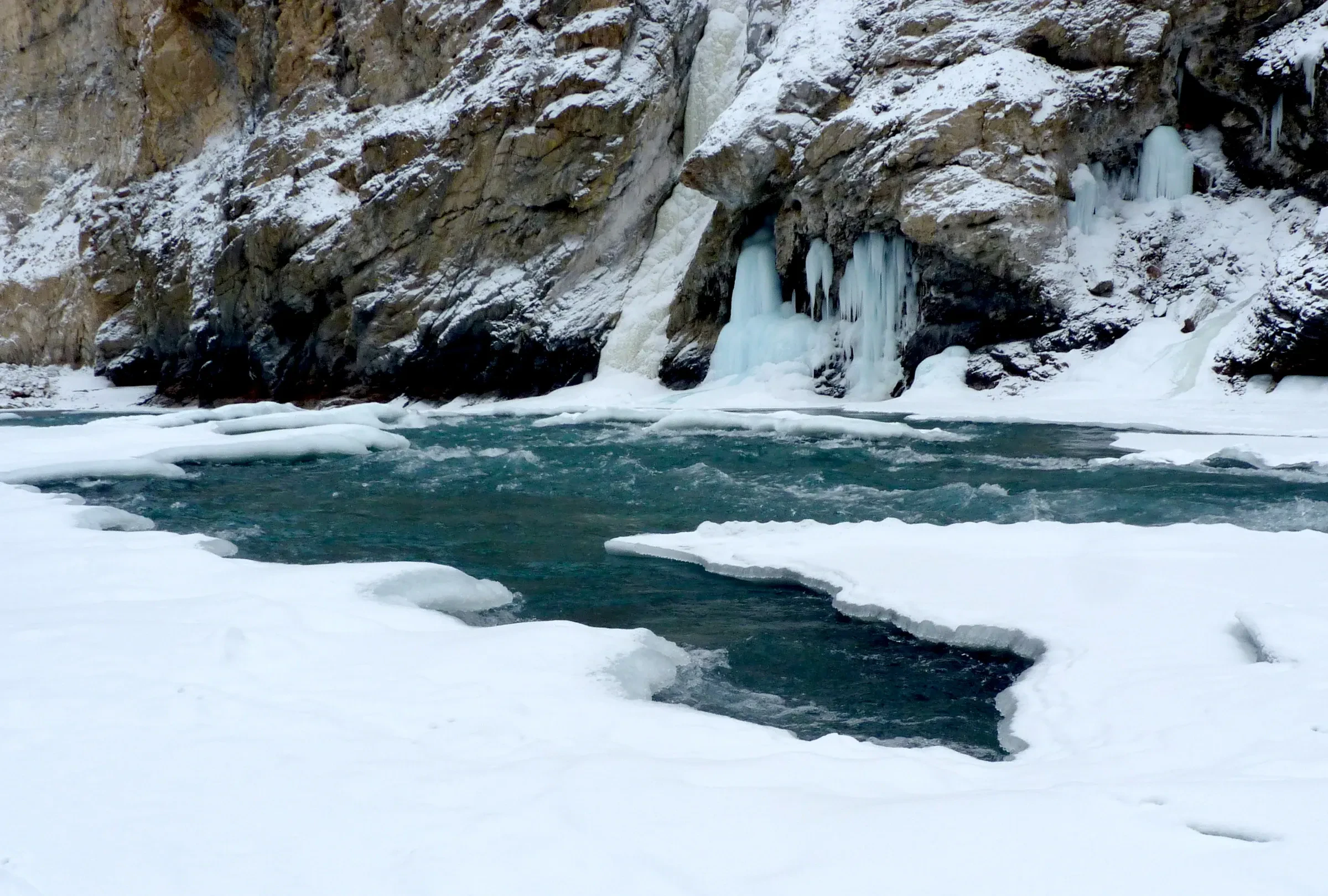 Ice formations and a half-frozen Zanskar River in the Chadar gorge, Ladakh