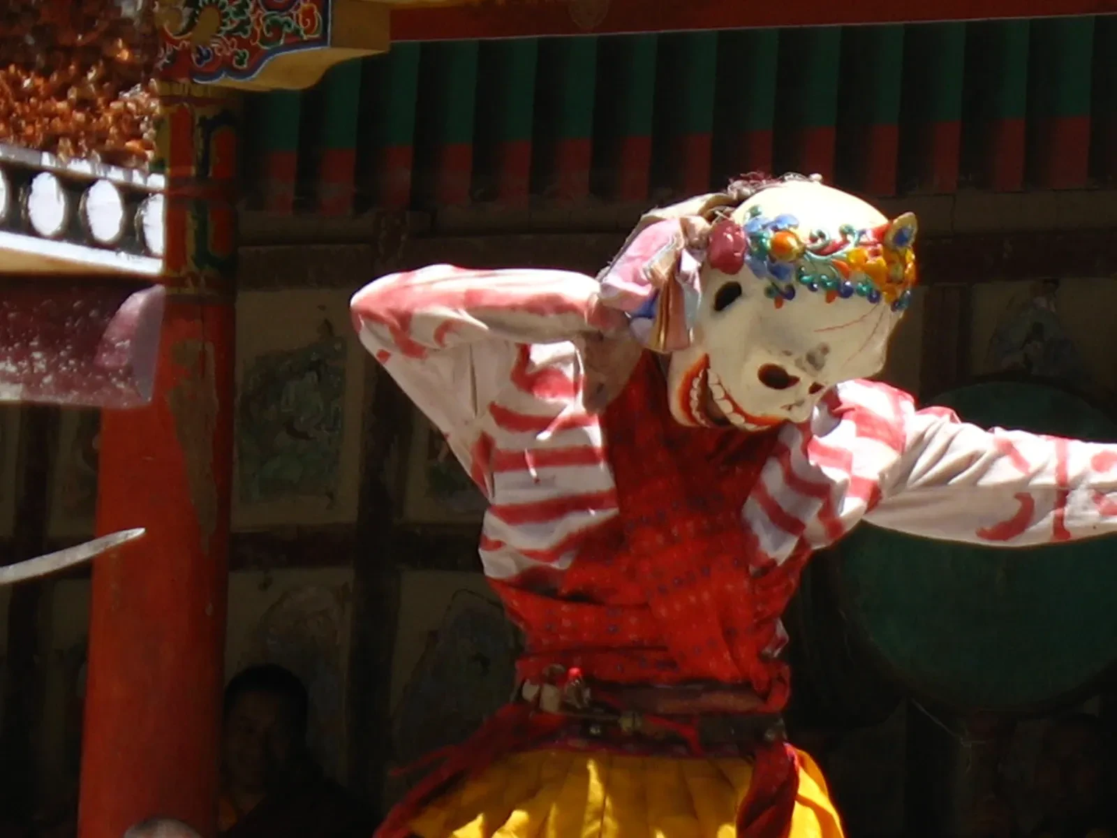 A masked dancer in the courtyard of Hemis Monastery during the Hemis festival
