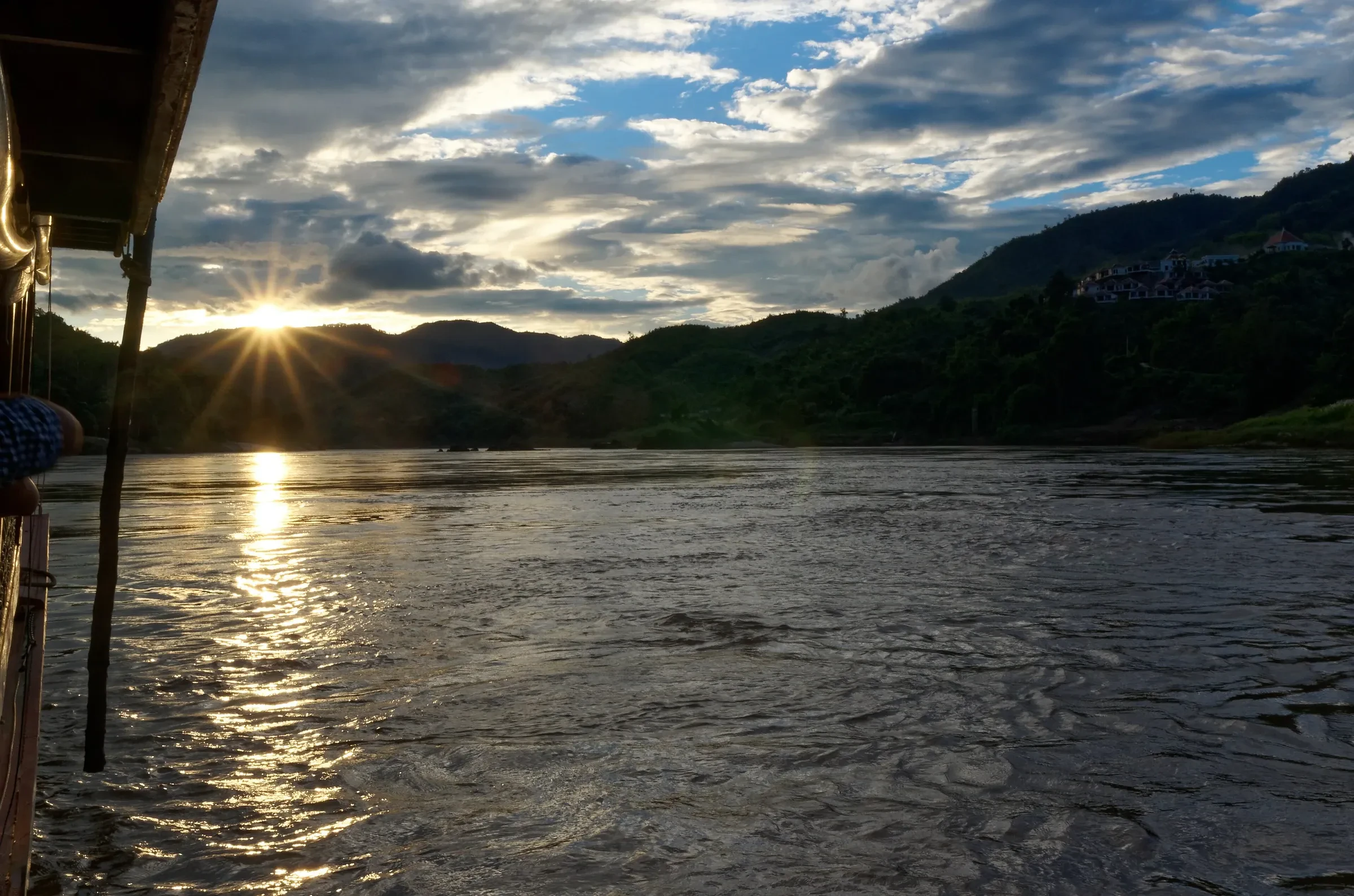Sunset over the Mekong seen from the deck of a slow boat near Pakbeng