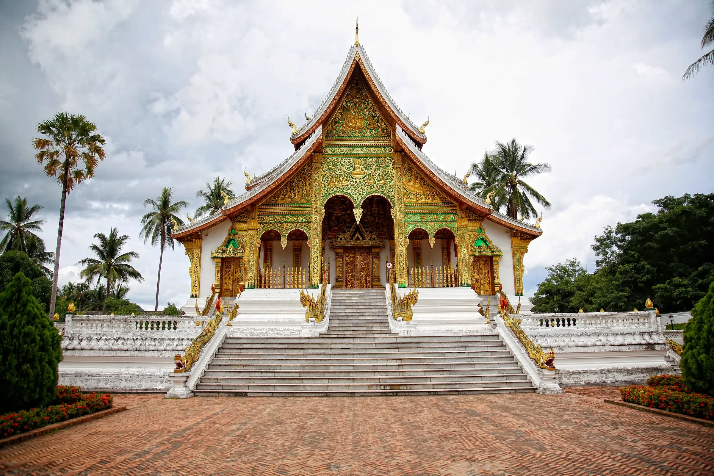 The gilded Haw Pha Bang chapel and its white staircase in Luang Prabang